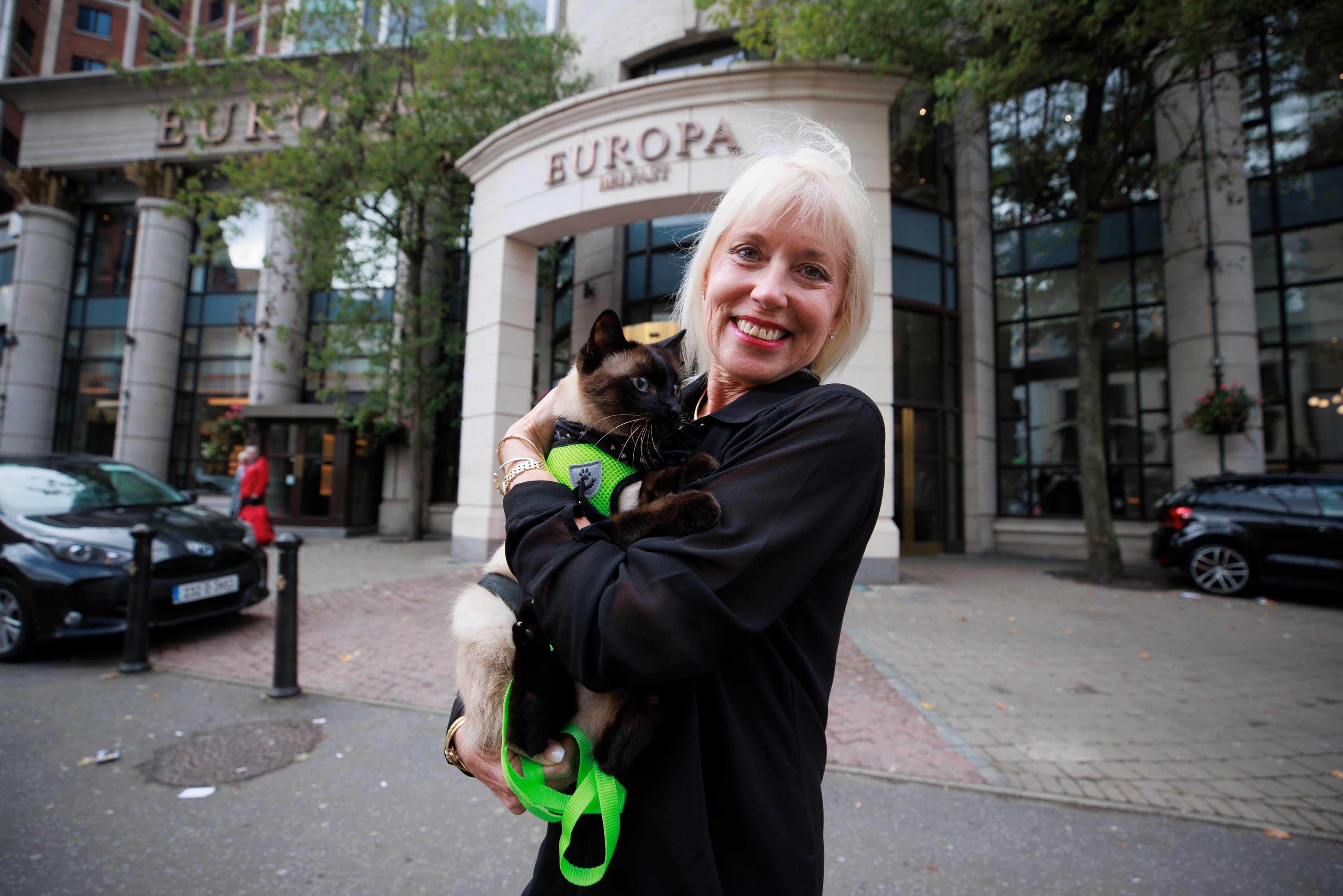 Holly Hennessy with her Siamese cat Captain at the Europa Hotel in Belfast