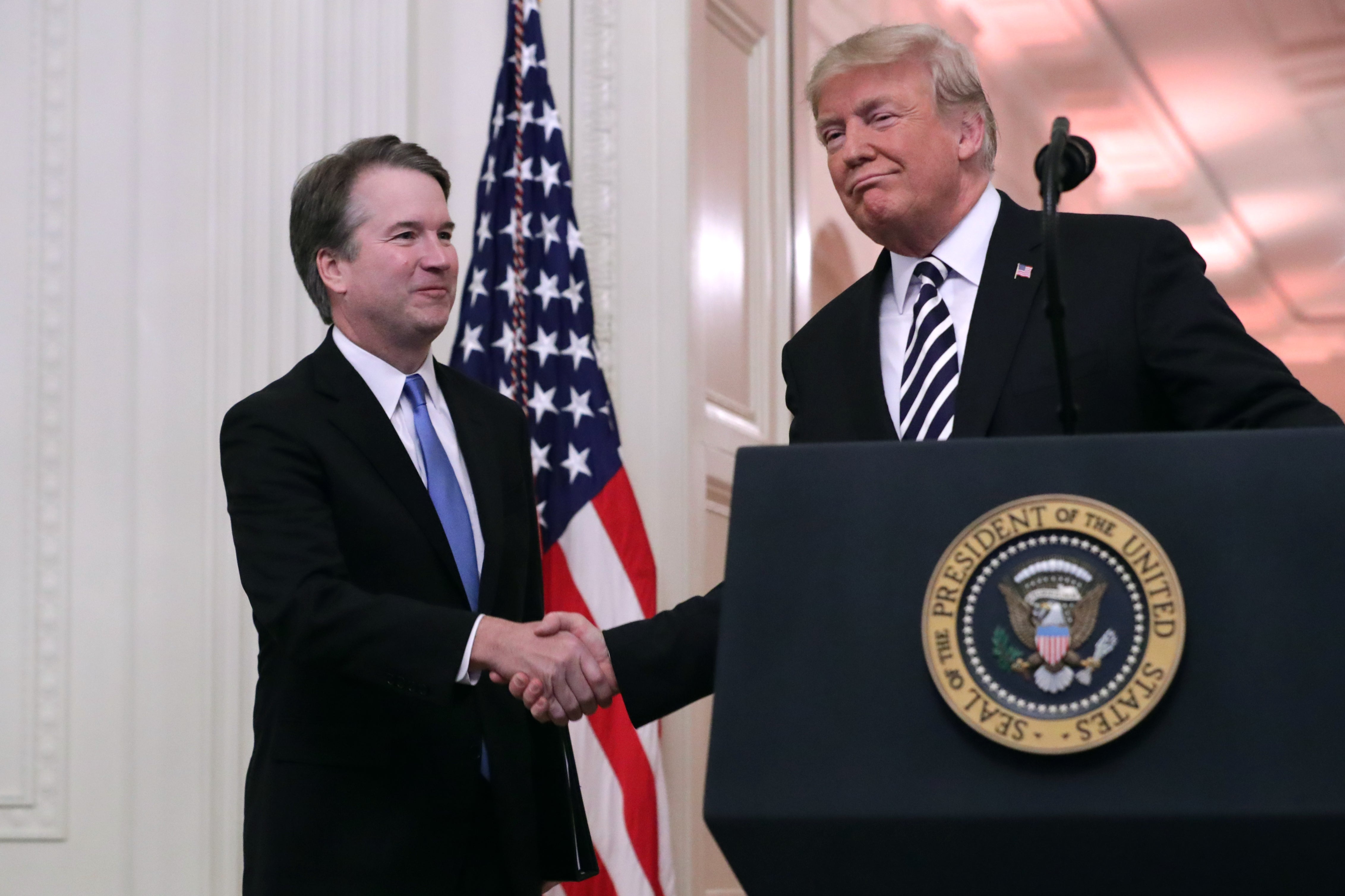 U.S. Supreme Court Justice Brett Kavanaugh (L) with then President Donald Trump during Kavanaugh's ceremonial swearing-in