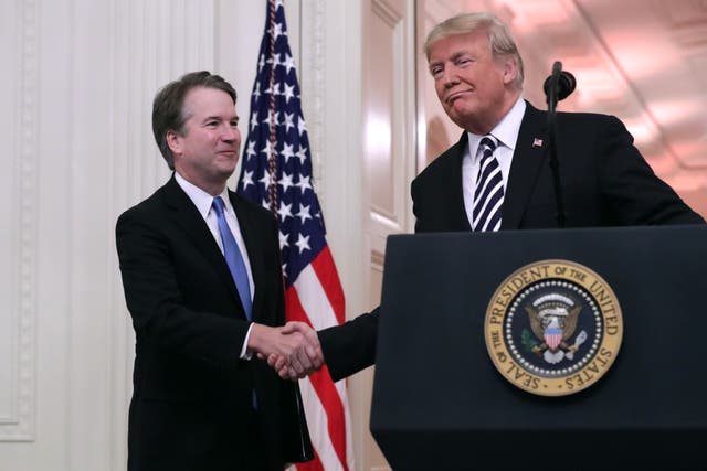 <p>U.S. Supreme Court Justice Brett Kavanaugh (L) shakes hands with President Donald Trump during Kavanaugh's ceremonial swearing in in the East Room of the White House October 08, 2018 in Washington, DC</p>