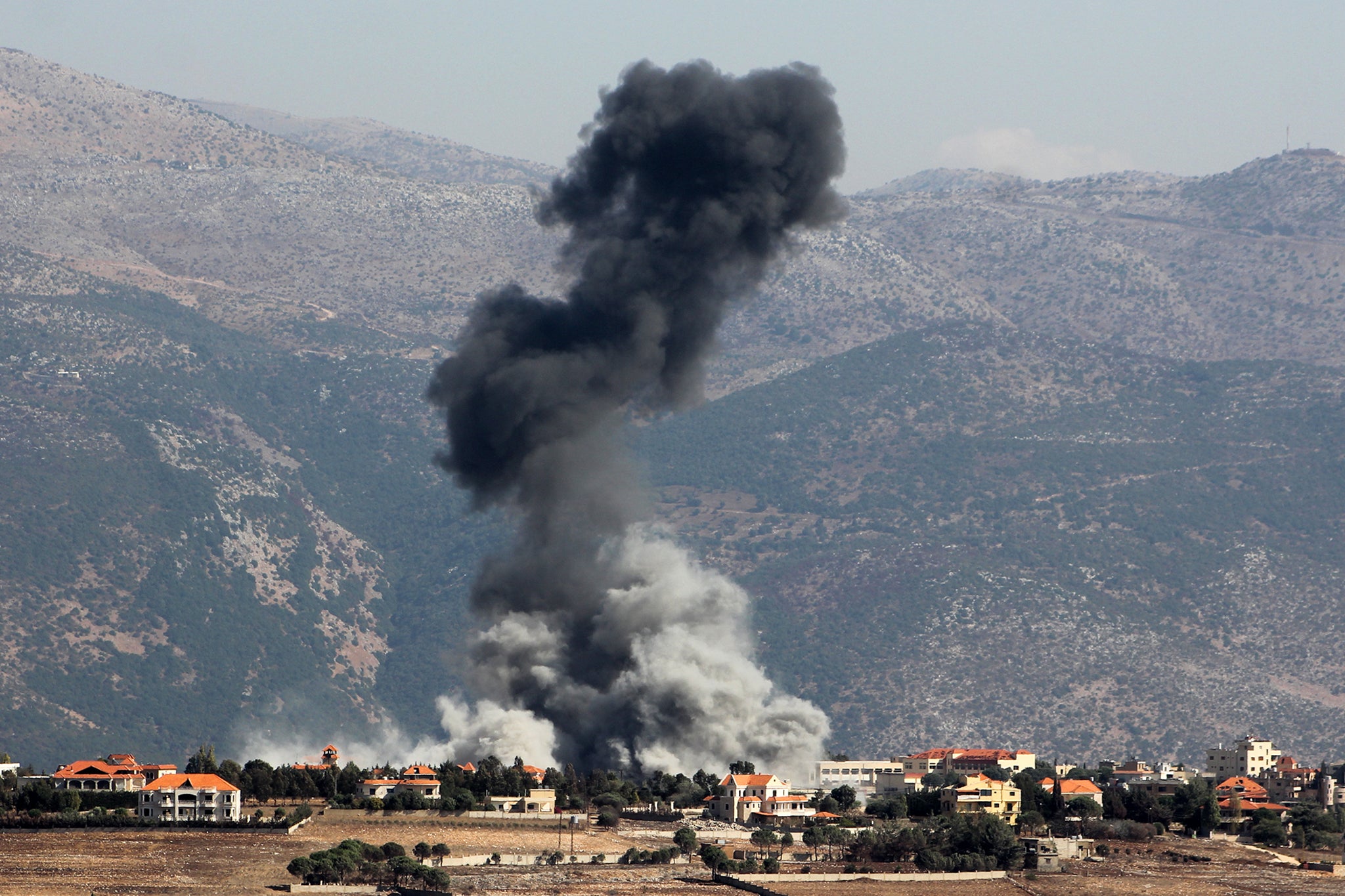 A plume of smoke billows following an Israeli airstrike on the village of Khiam in southern Lebanon