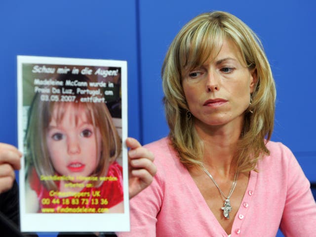 <p> Kate Mc Cann, the mother of the  missing Madeleine McCann looks at a poster showing her missing daughter during a press conference on June 6, 2007 in Berlin, Germany</p>