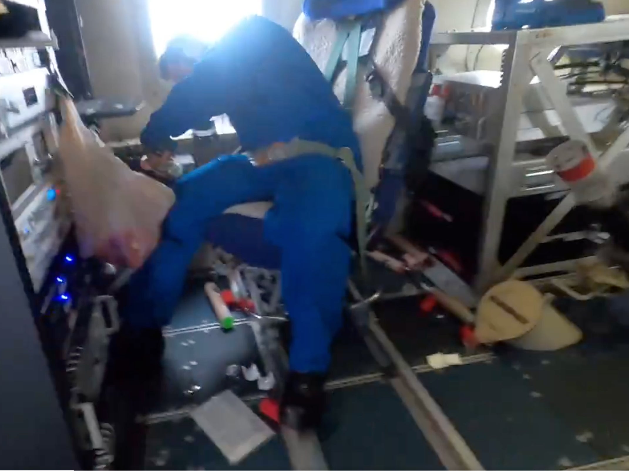 An NOAA researcher aboard the ‘Missy Piggy’ aircraft is surrounded by debris after Hurricane Milton’s 155mph winds jostled the plane on October 8, 2024