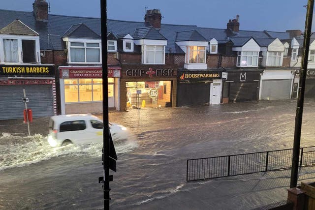 A car on a flooded road in Grangetown, Sunderland (Billy Malcolm William Smillie/PA)