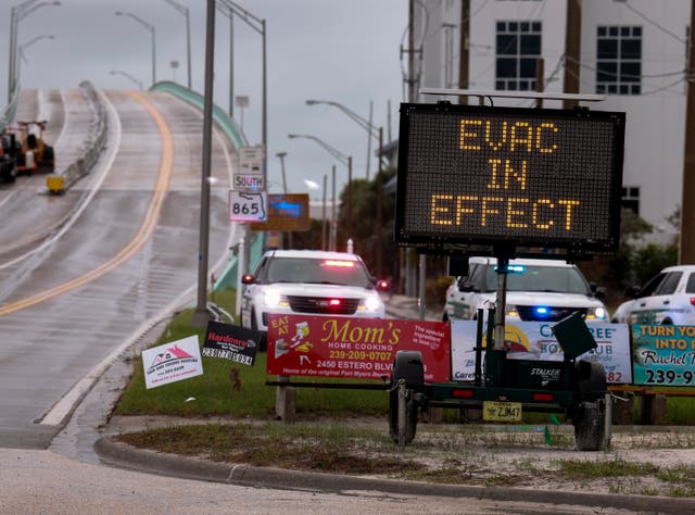 <p>A sign indicates that an evacuation order is in effect for the beach area before Hurricane Milton's arrival on October 08, 2024, in Fort Myers, Florida</p>