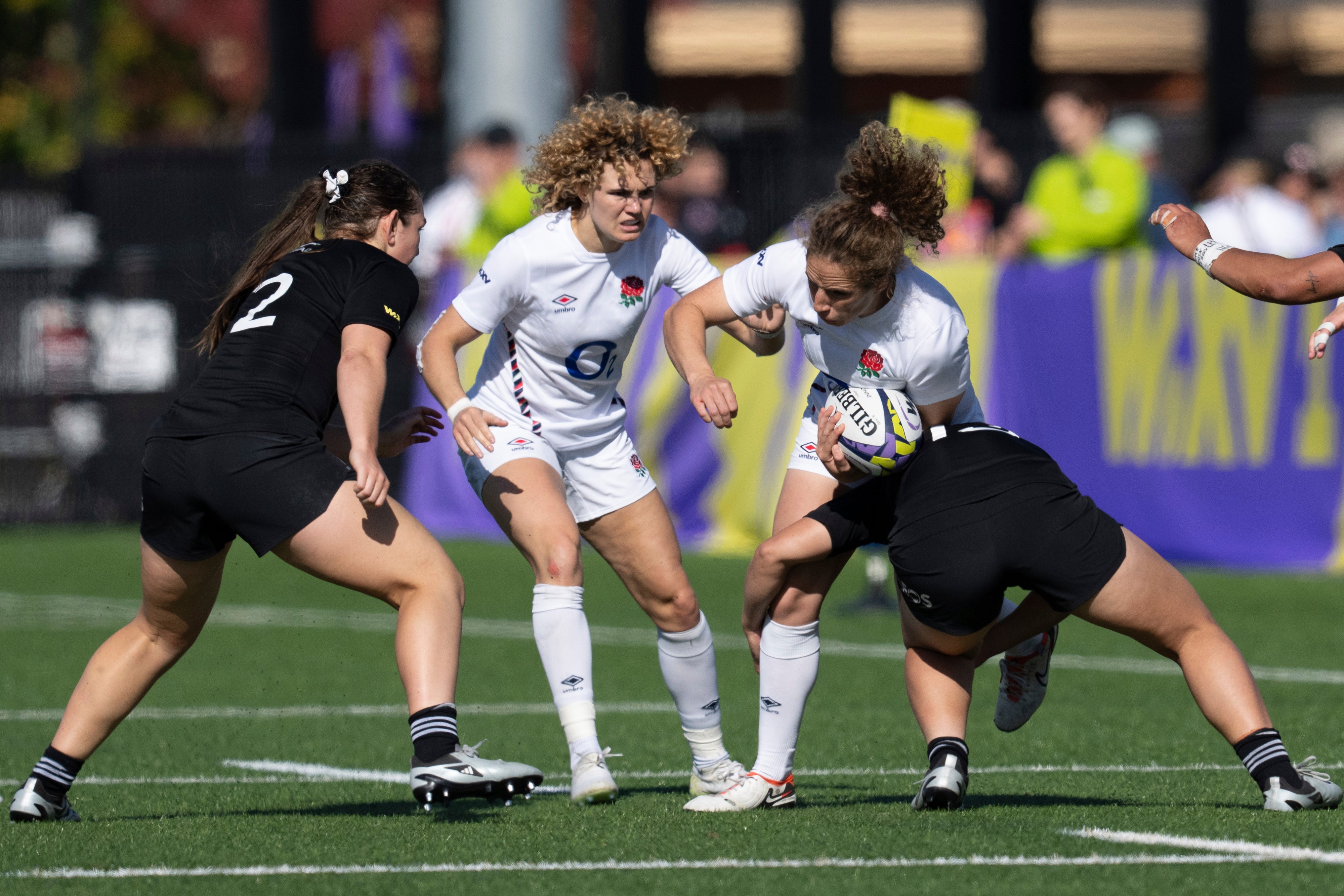 New Zealand’s Sylvia Brunt, right, tackles England’s Abby Dow, second right, as New Zealand’s Georgia Ponsonby and England’s Ellie Kildunne watch