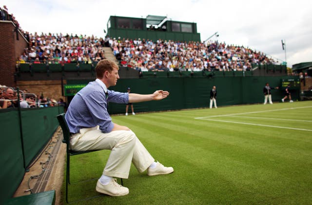 <p>A line judge makes a decision on court 18 at Wimbledon</p>