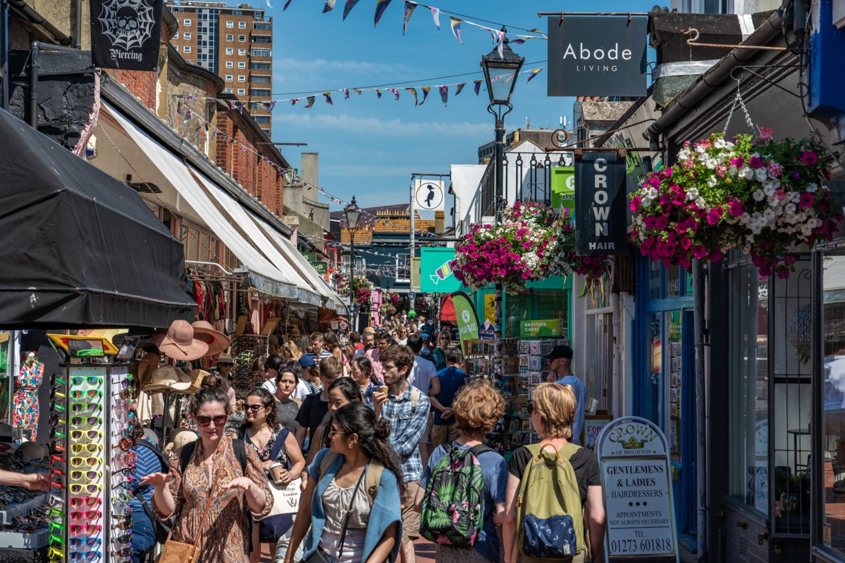 Brighton’s Lanes and its vibrant nightlife scene attracts tourists along with families spending time by the seaside