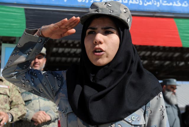 <p>File. An Afghan policewoman salutes during a graduation ceremony in Herat in 2014 </p>