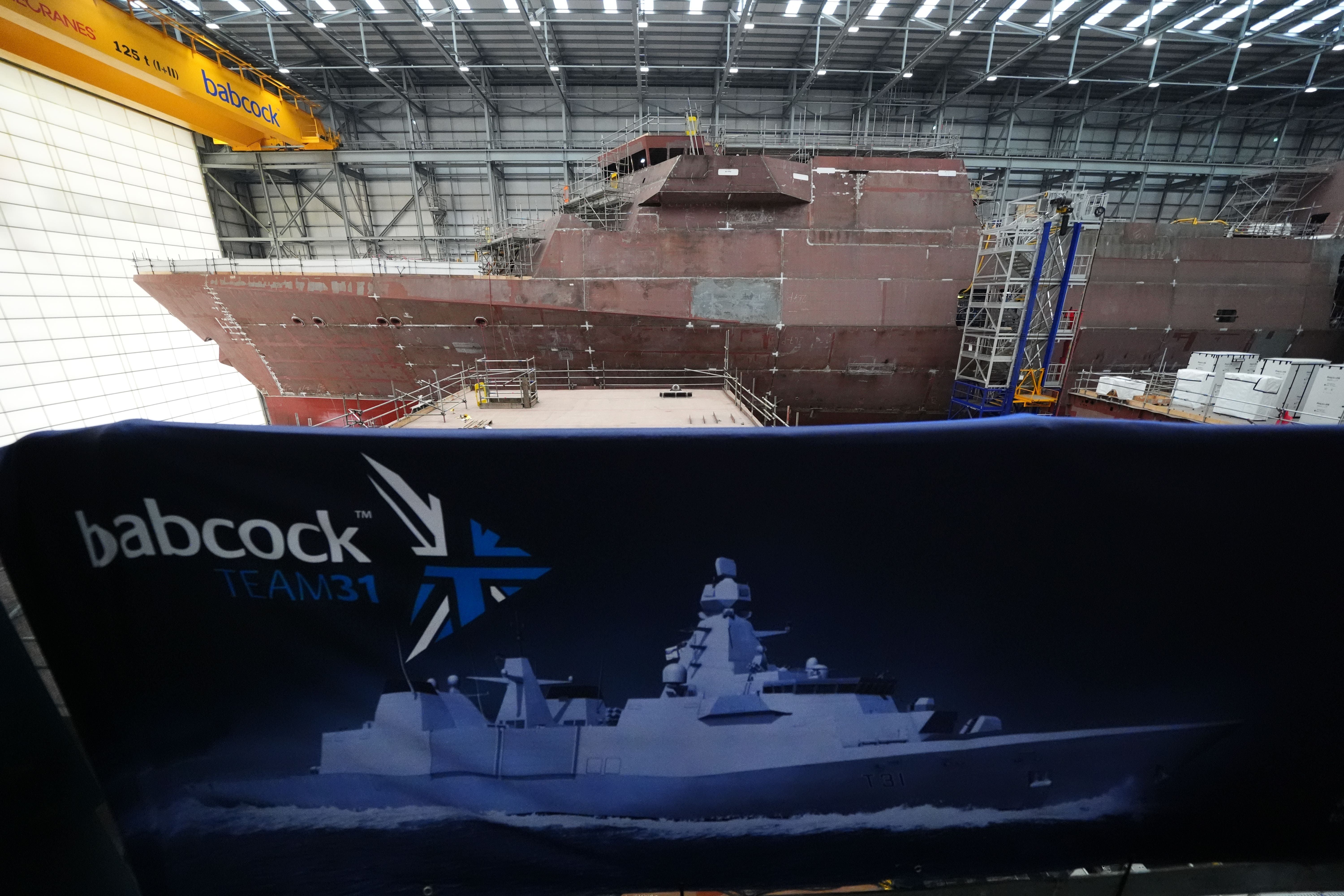 Construction work continues on HMS Venturer, top, and HMS Active ahead of the steel cut ceremony for HMS Formidable (Andrew Milligan/PA)