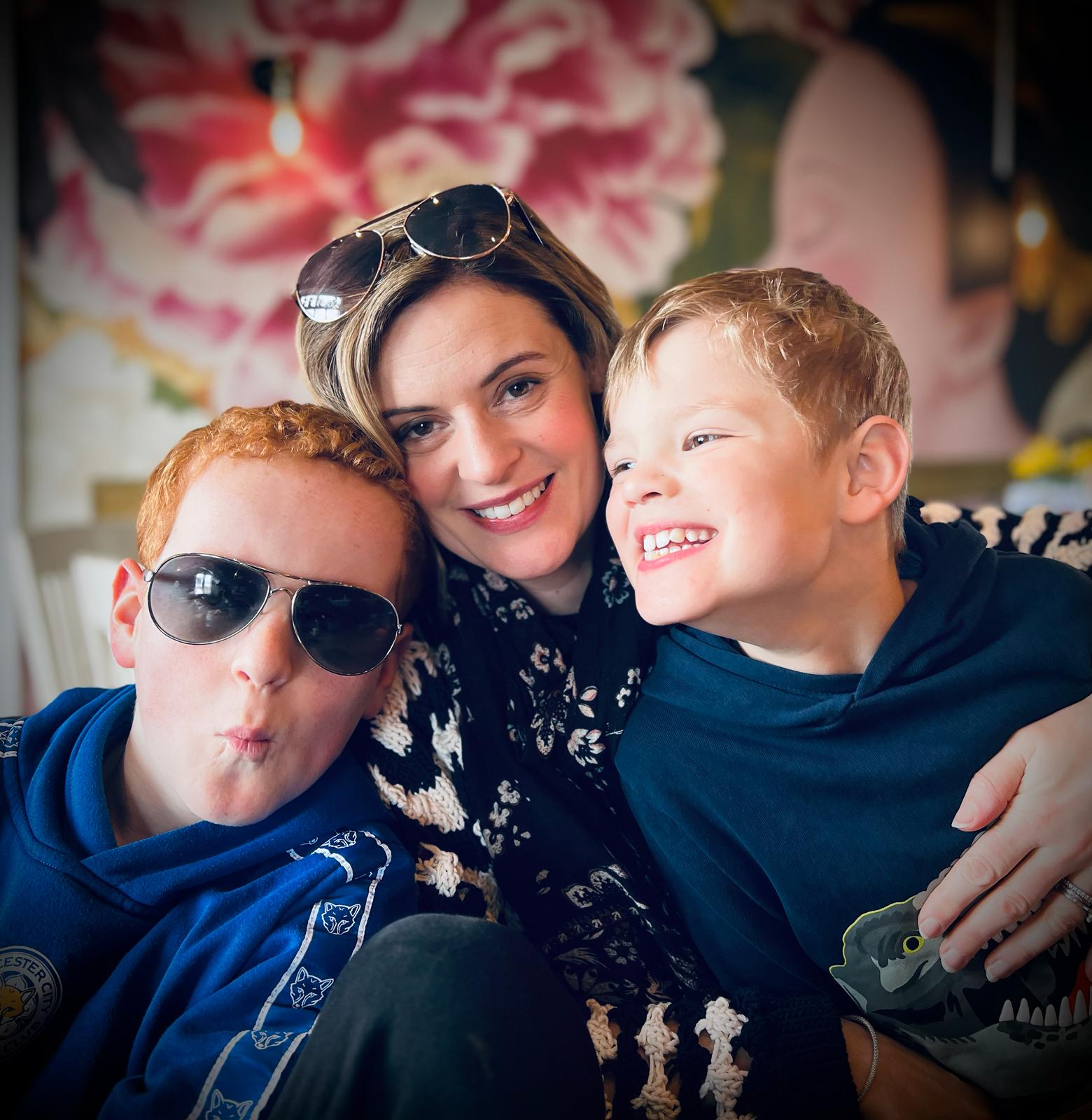 Alex McQuade with sons Evan (left) and Xander (right), who have Fragile X syndrome