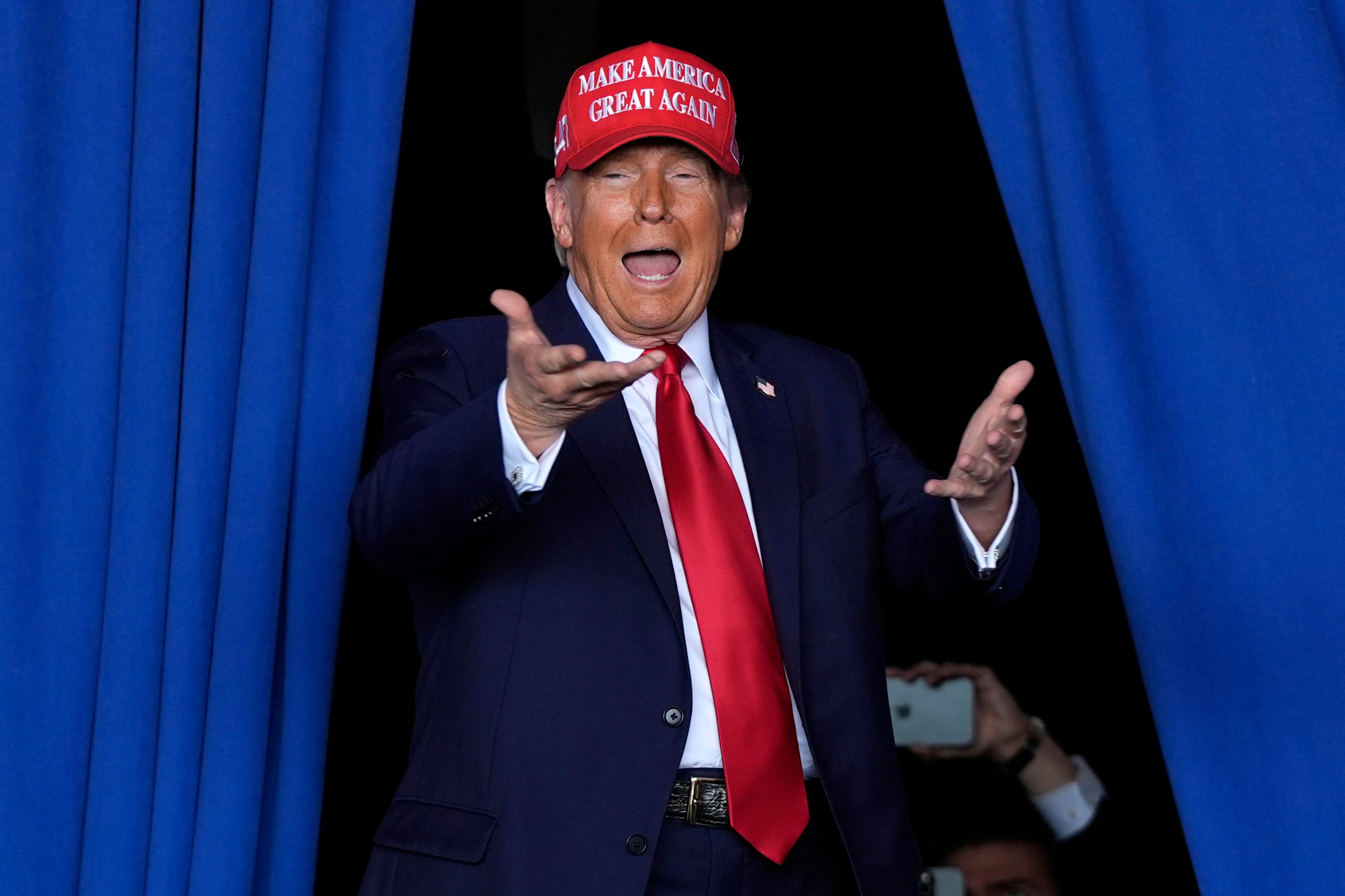 Donald Trump arrives to speak during a campaign rally at the Dodge County Airport on Sunday, October 6, 2024, in Juneau, Wisconsin.