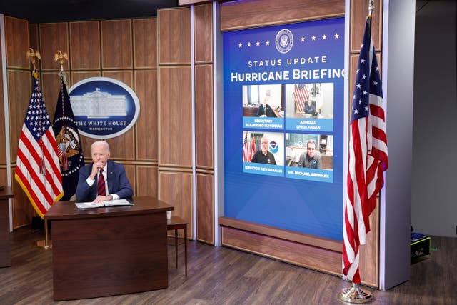 <p>President Joe Biden listens during a briefing on hurricane relief efforts at the White House on October 9. </p>