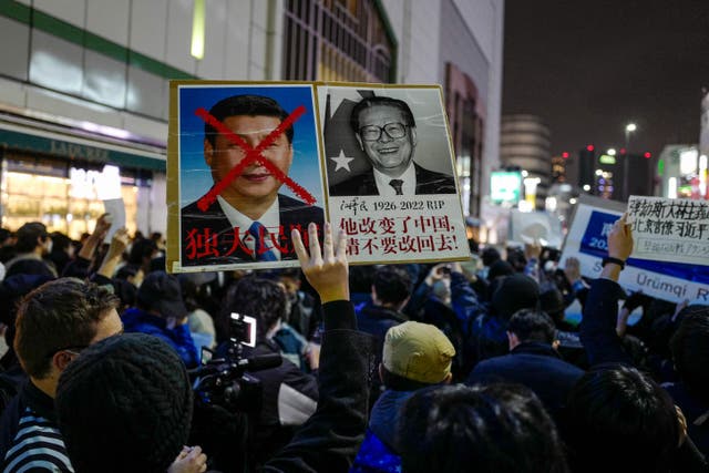 <p>File. Chinese people in Japan and supporters stage a rally to protest against China's Covid policy in Tokyo on 30 November 2022 </p>