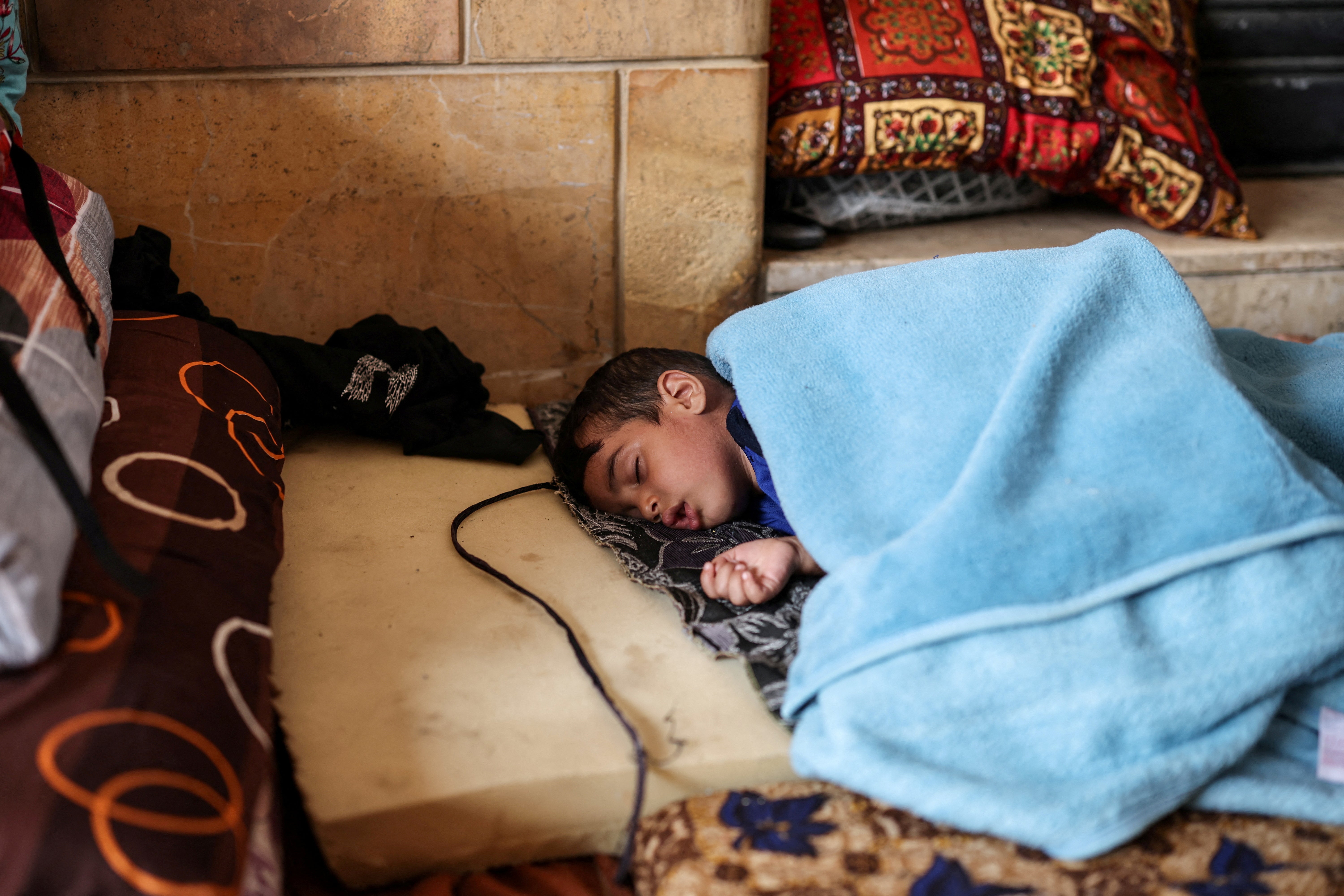 A displaced child sleeps in Beirut's downtown business district