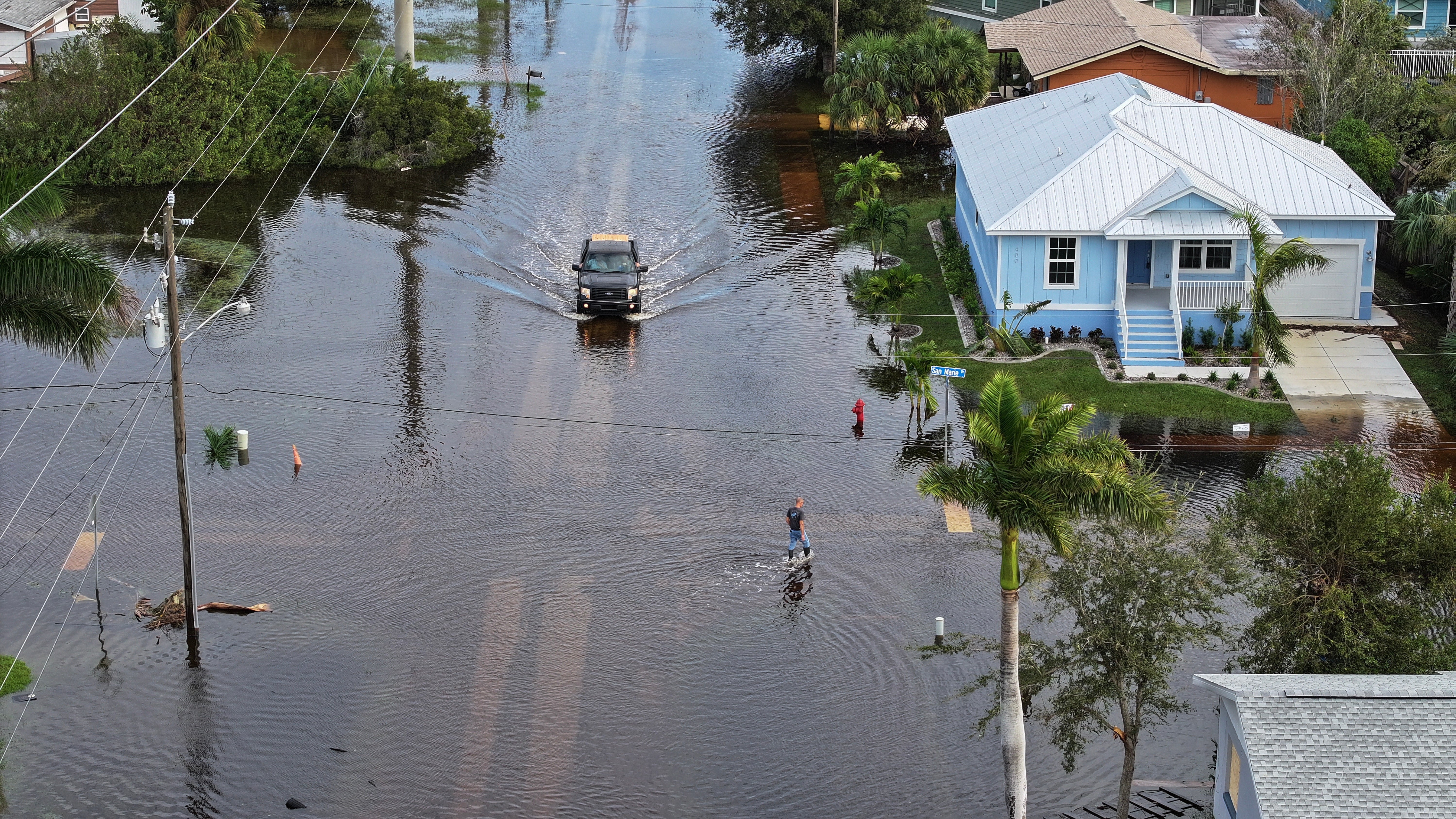 This aerial view taken the day after the hurricane shows a person walking through the flood waters in Punta Gorda, Florida. In some parts of the state, it was predicted that flood waters would rise up to 15 feet. However, evacuation orders were starting to be lifted, allowing people to return to their homes