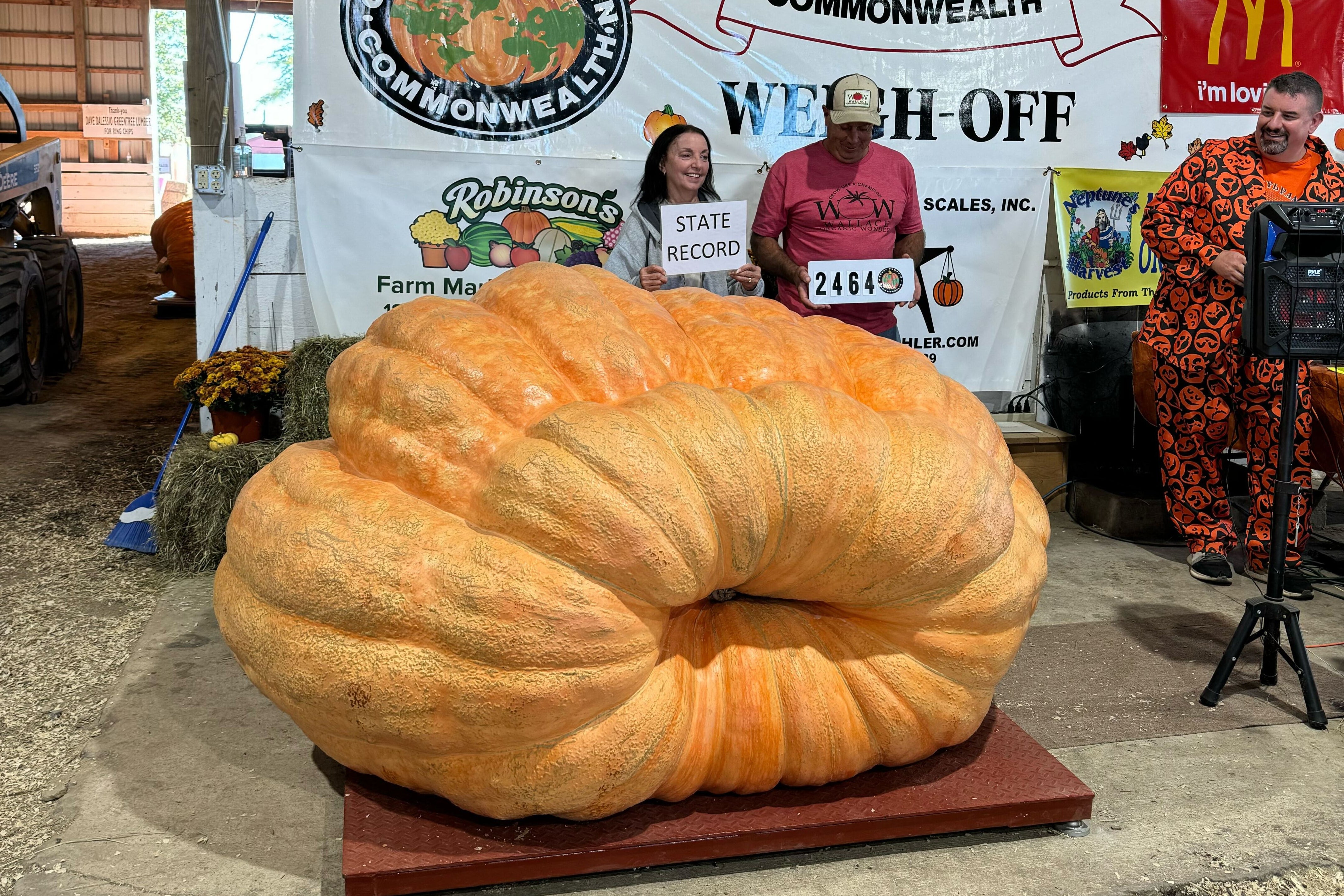 Carol and Dave Stelts with their state record-setting pumpkin, which weighed 2,464 pounds