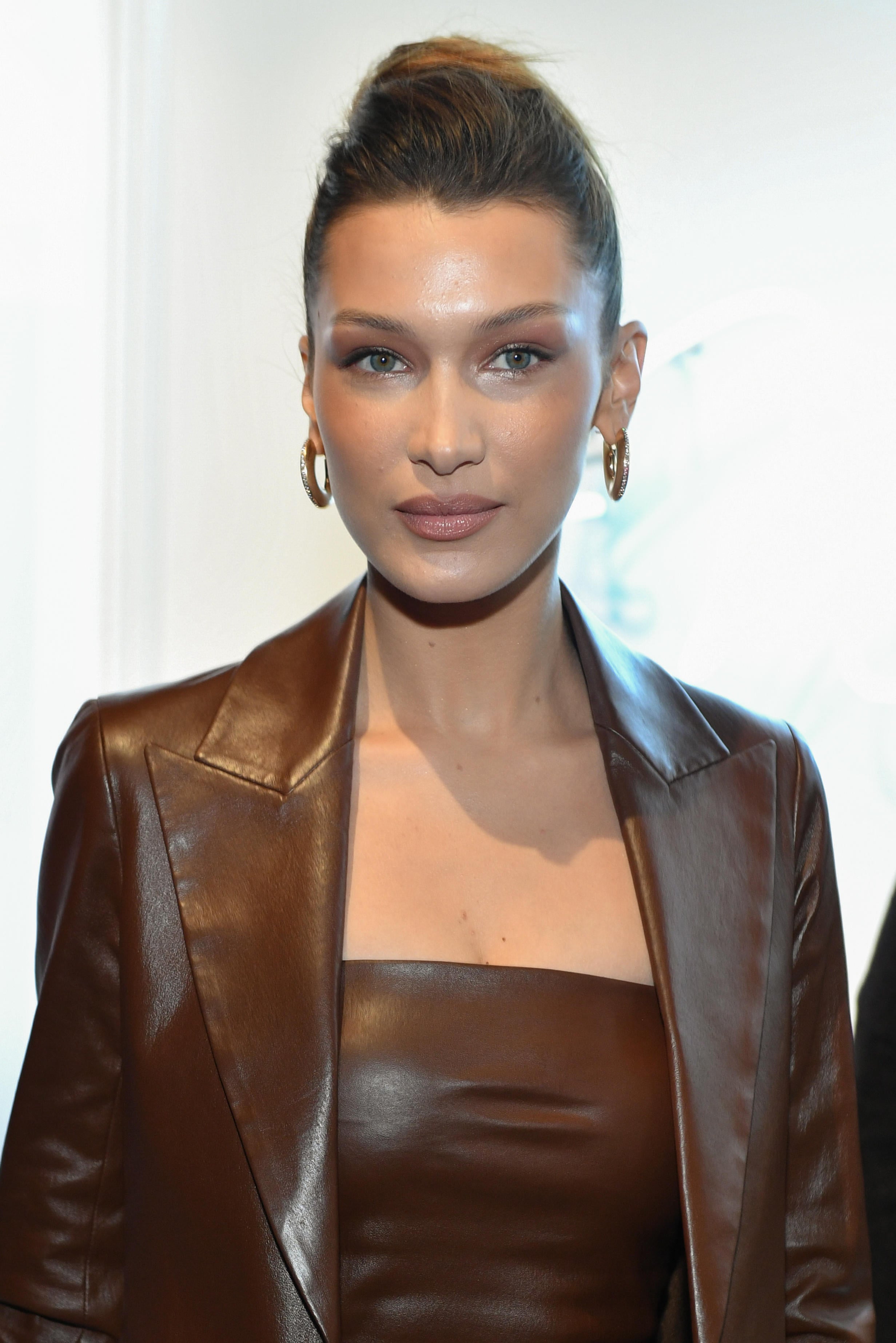 Bella Hadid has worn a fringe, slicked back hair and long layers with her oval face shape (Alamy/PA)