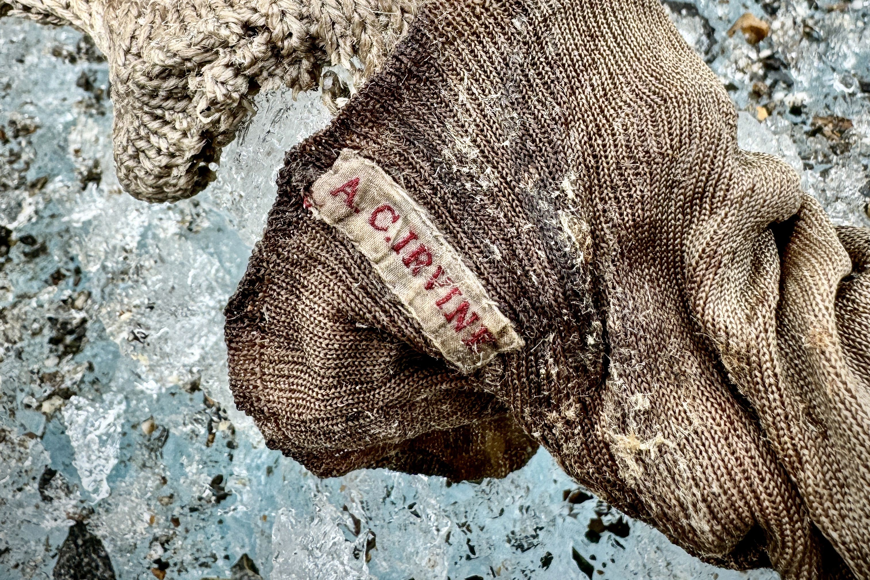 A sock embroidered with ‘AC Irvine’ and a boot were discovered on the Central Rongbuk Glacier below the mountain’s North Face (Jimmy Chin/National Geographic/PA)