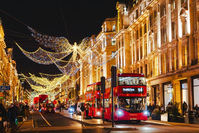 <p>Wandering beneath the  Christmas lights on Oxford Street is a popular activity among day-trippers </p>