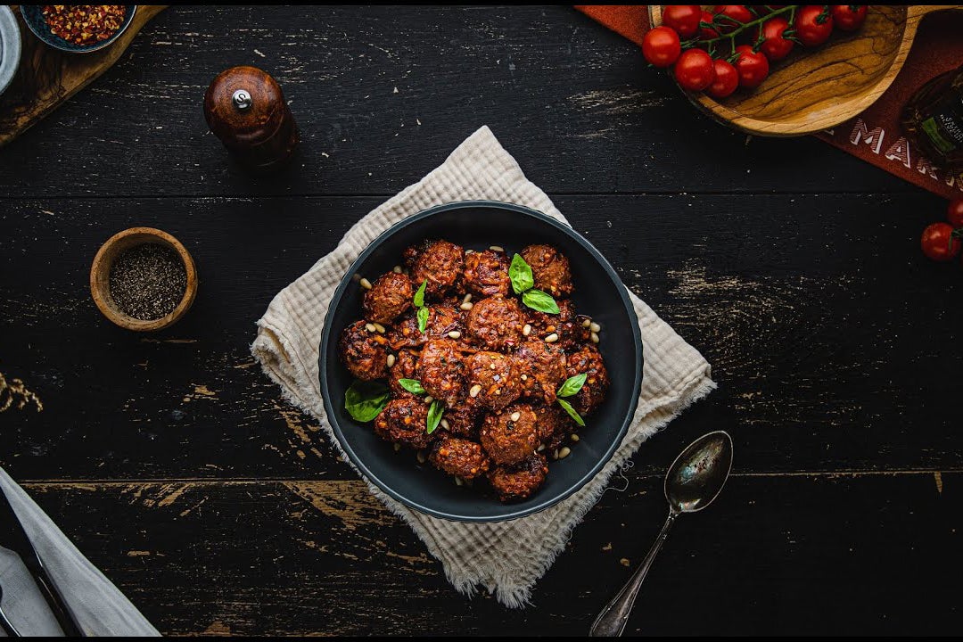 Rustic and hearty: spiced tomato and basil baked meatballs, with the depth of flavour only tinned tomatoes can deliver