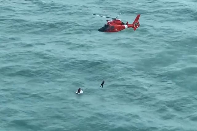 <p>Pictured: US Coast Guard rescues man clinging onto ice box after being washed away in Hurricane Milton </p>