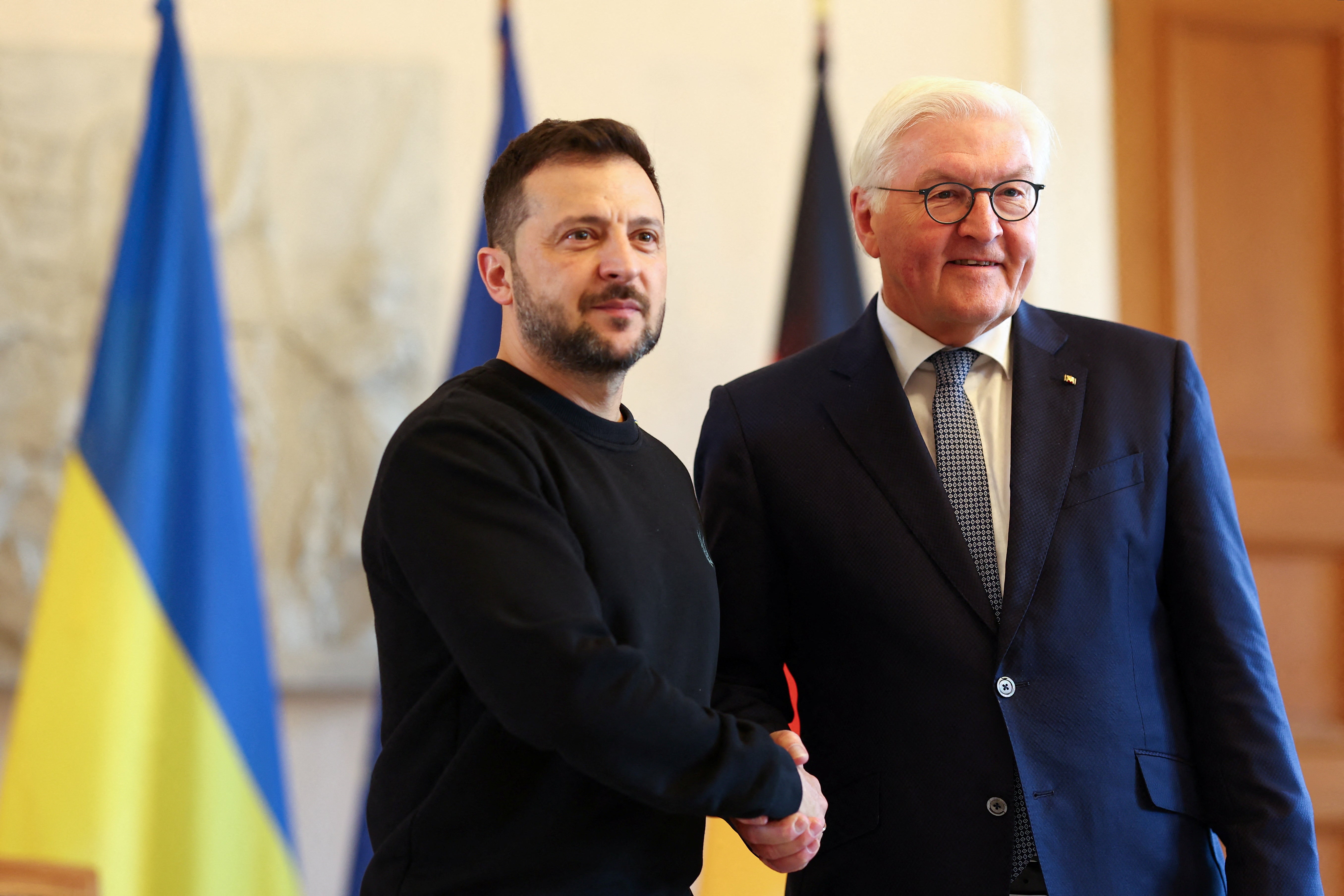 Ukrainian President Volodymyr Zelensky shakes hands with German President Frank-Walter Steinmeier at Bellevue Palace in Berlin, Germany