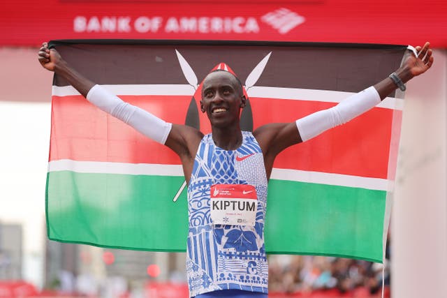 <p>Kelvin Kiptum of Kenya celebrates after winning the 2023 Chicago Marathon</p>