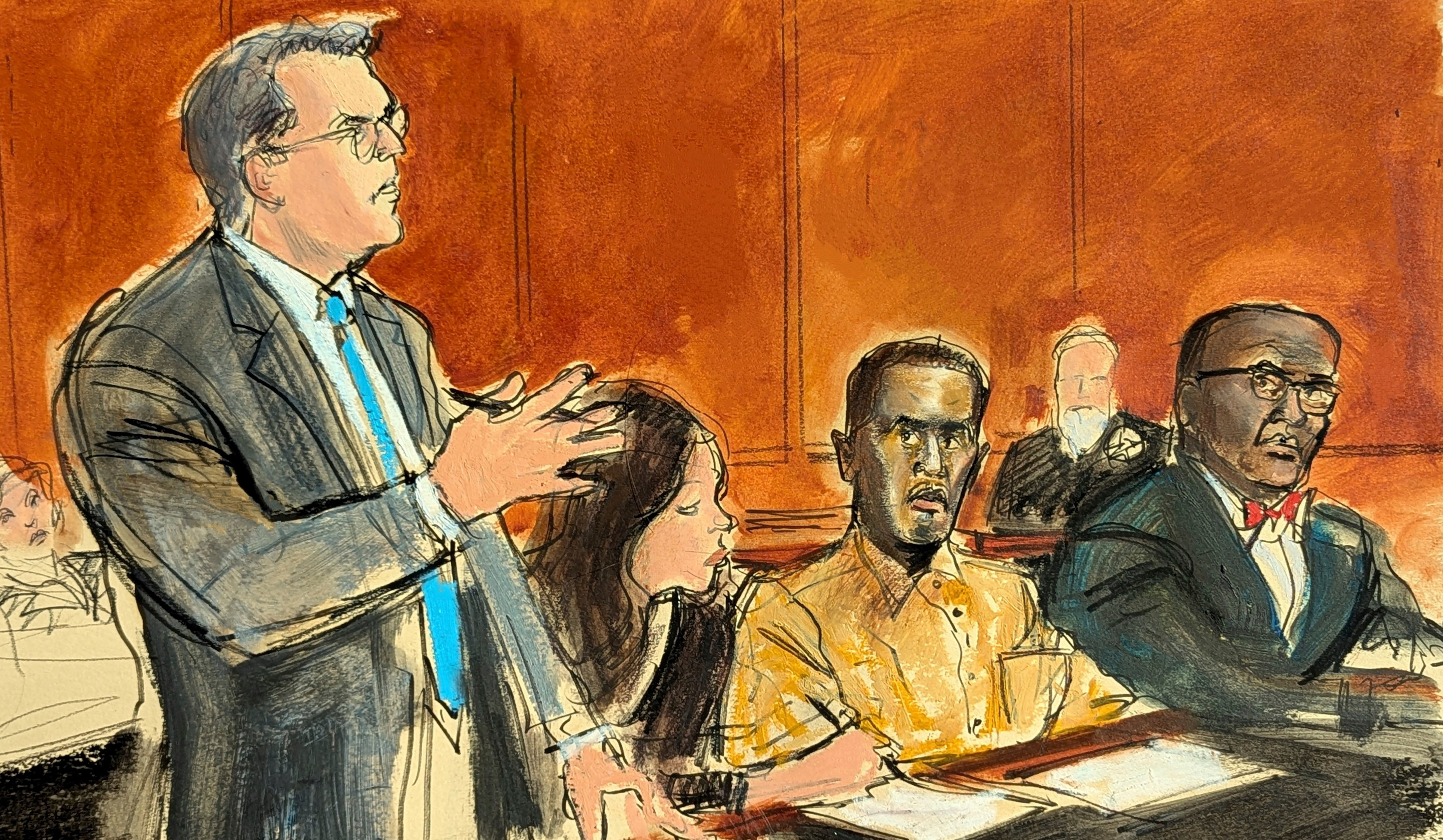 In this courtroom sketch, Sean "Diddy" Combs' defense attorney Marc Agnifilo, left, addresses the judge while Combs, seated second from right, in prison uniform, watches during a hearing in federal court in New York, Thursday, 10 Oct 2024