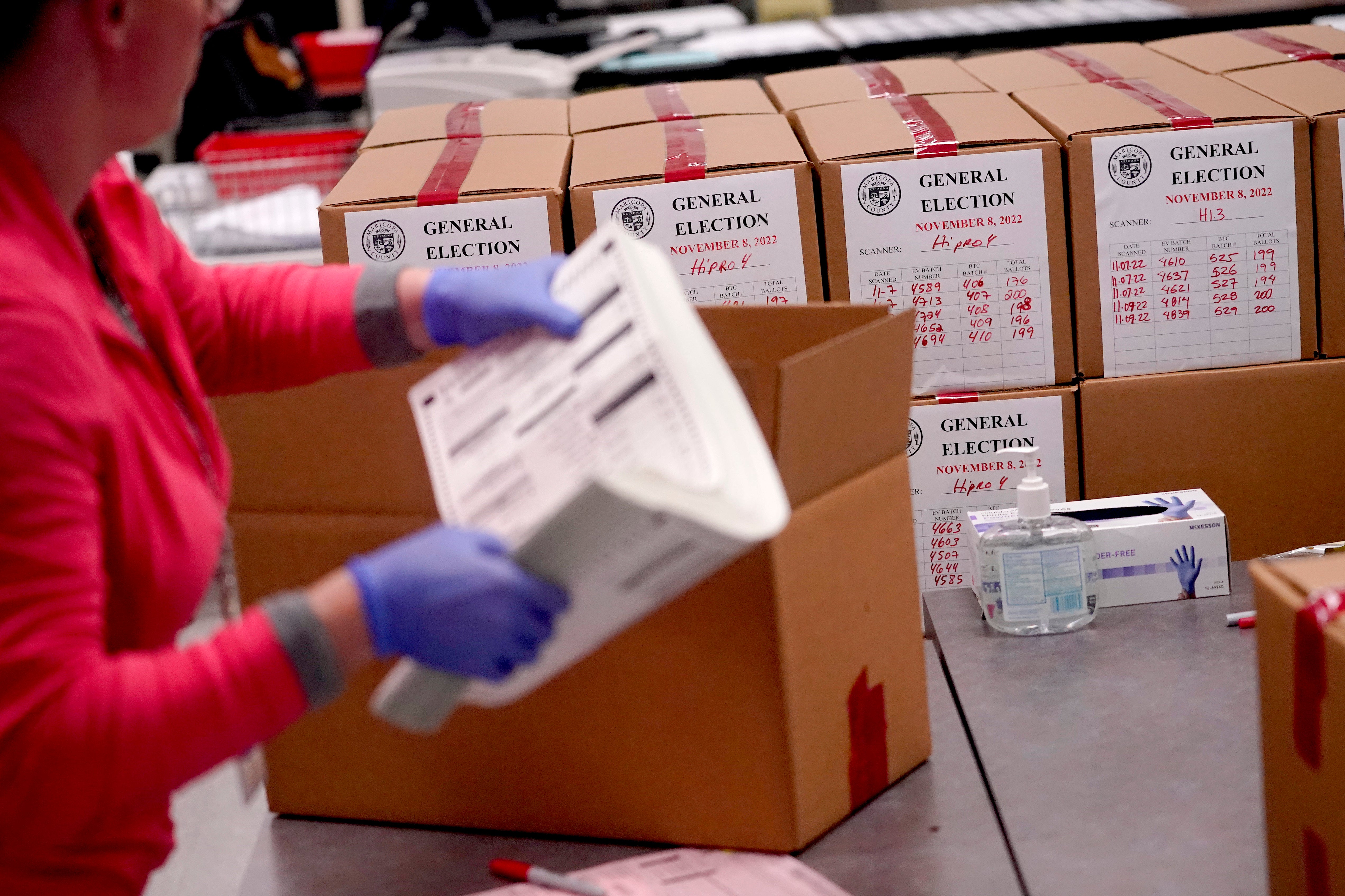 An election worker boxes tabulated ballots inside the Maricopa County Recorders Office in Phoenix, Arizona, which has become a hotbed for election conspiracy theories.