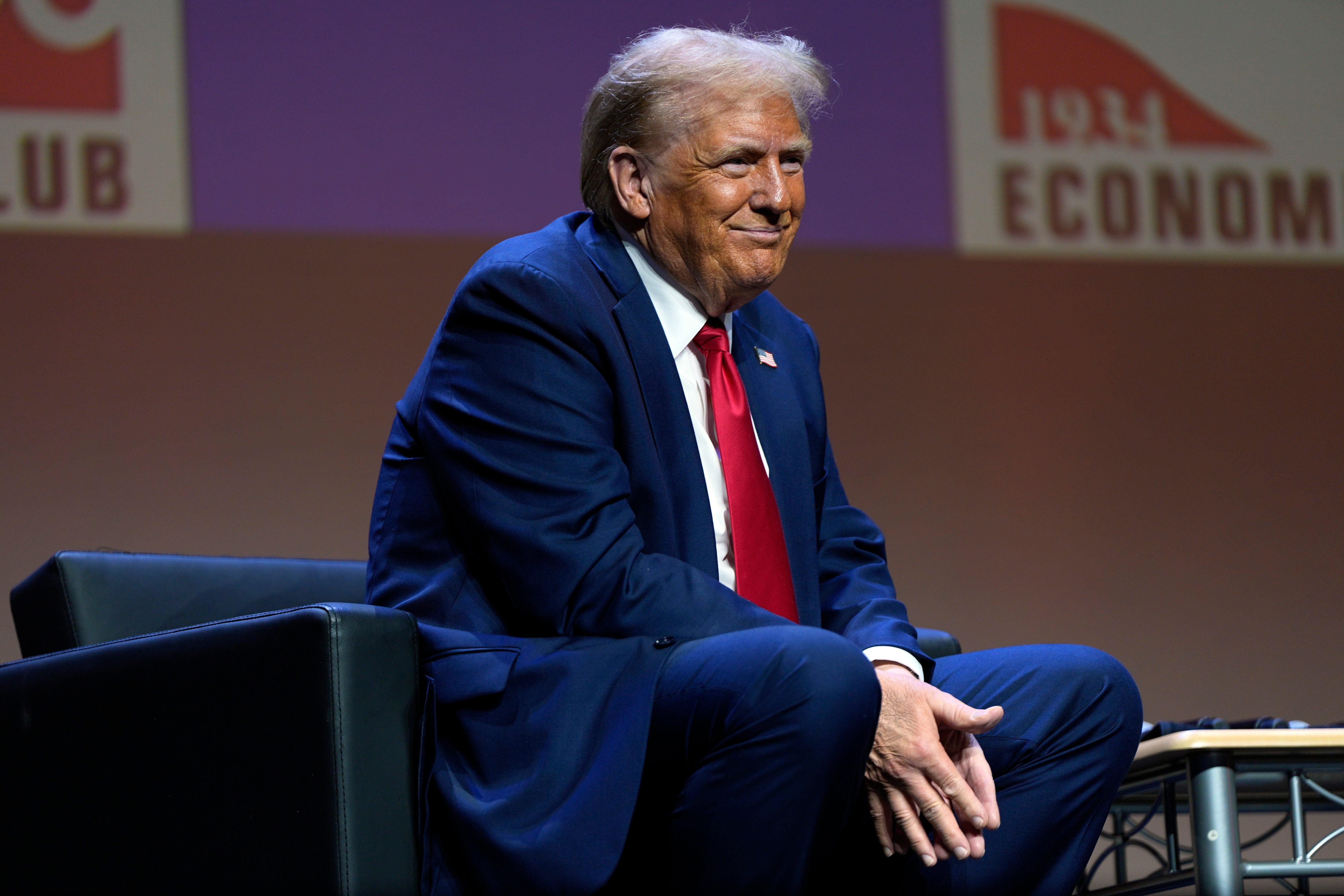 Republican presidential candidate and former President Donald Trump listens as he answers questions at a meeting of the Detroit Economic Club on Thursday. Trump's own health has drawn more attention given his advanced age and his behavior on the campaign trail