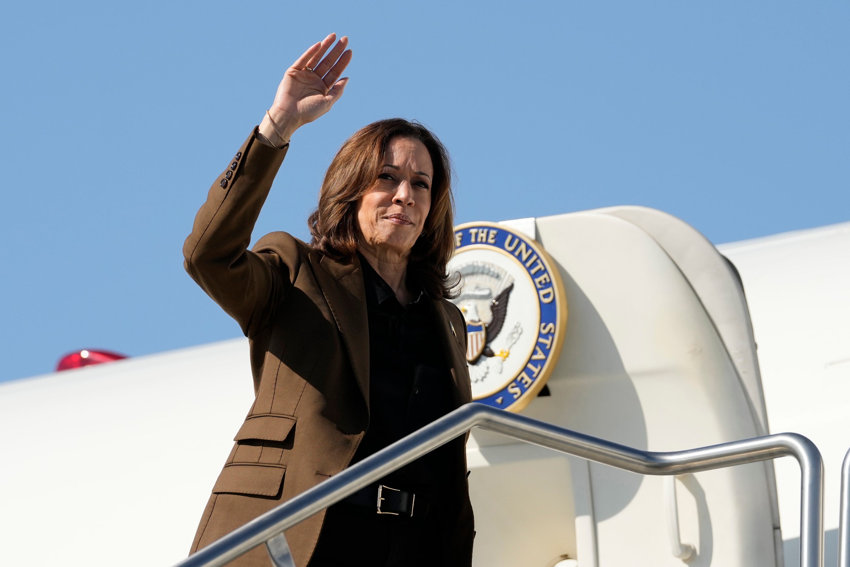 Vice President Kamala Harris waves as she boards Air Force Two on Friday. Vance has faced backlash for calling her a ‘childless cat lady’