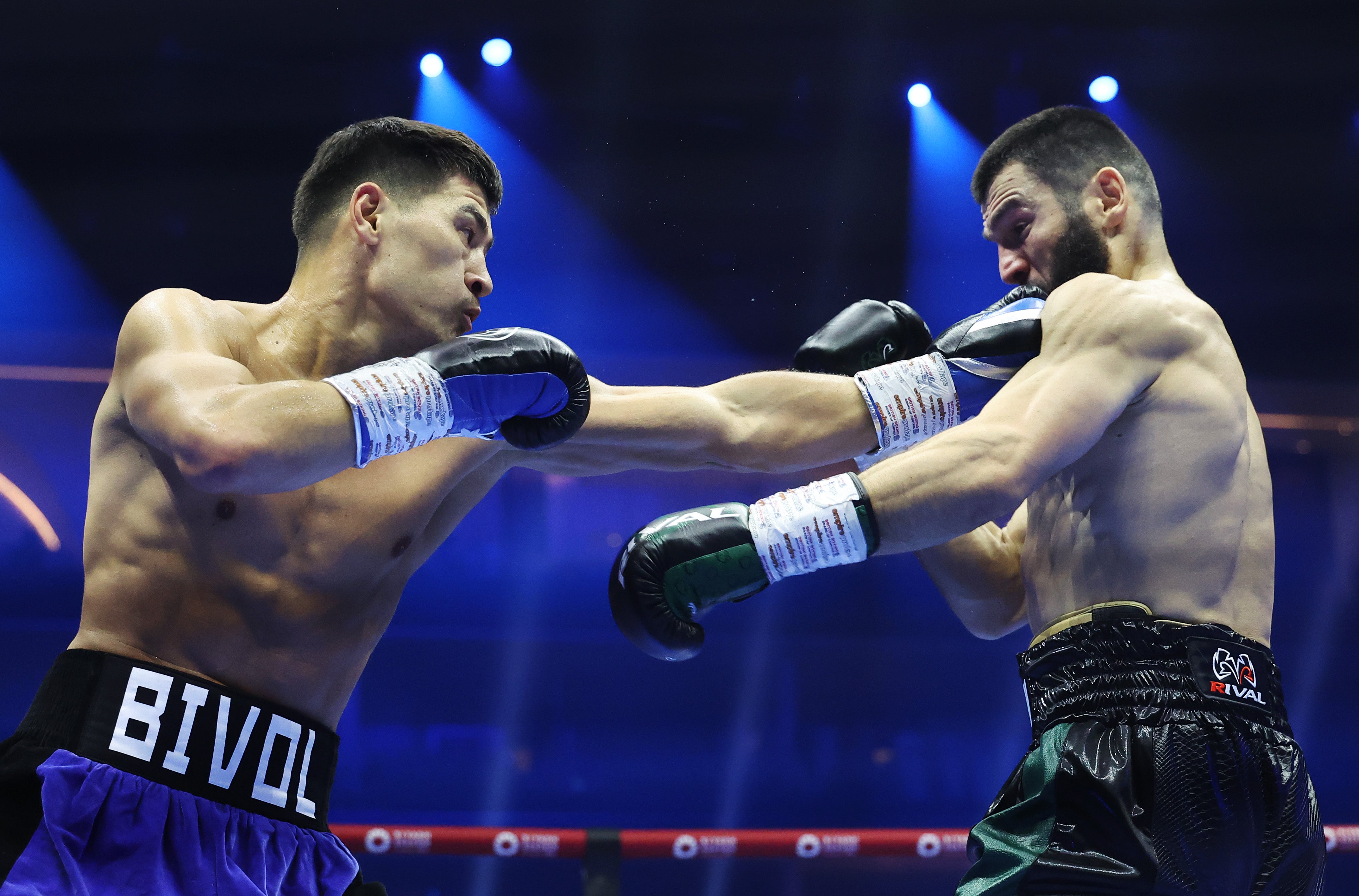 Dmitry Bivol (left) jabbing Artur Beterbiev