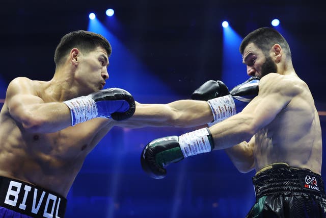 <p>Dmitry Bivol (left) jabbing Artur Beterbiev</p>