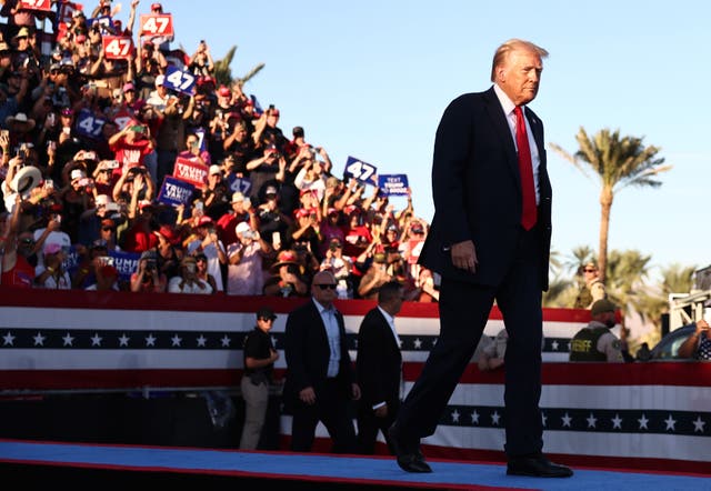 <p>Republican presidential nominee, former U.S. President Donald Trump walks onstage for a campaign rally on October 12 in Coachella, California</p>