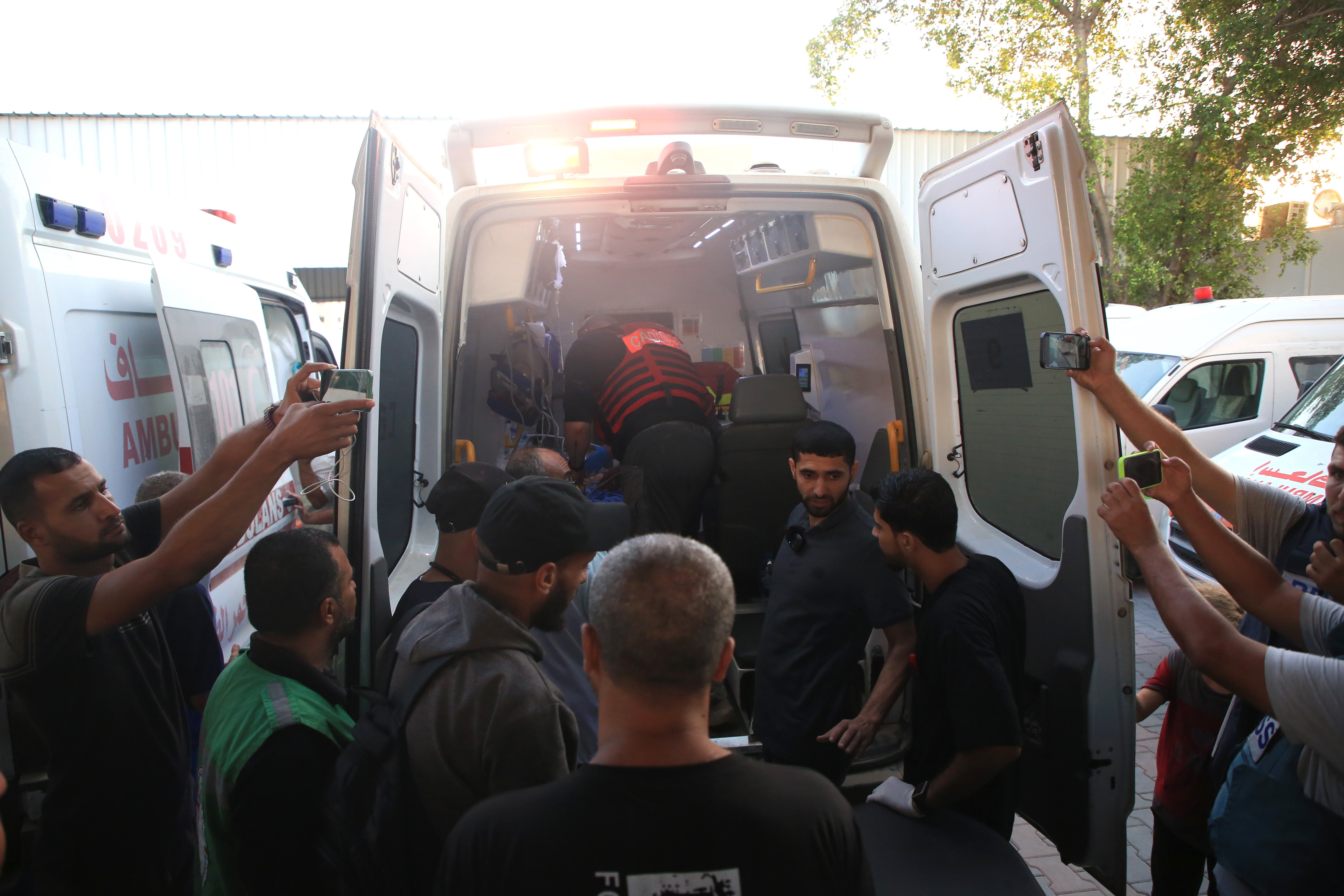 Ambulances, carrying patients from Kamal Adwan Hospital in Beit Lahya in northern Gaza Strip