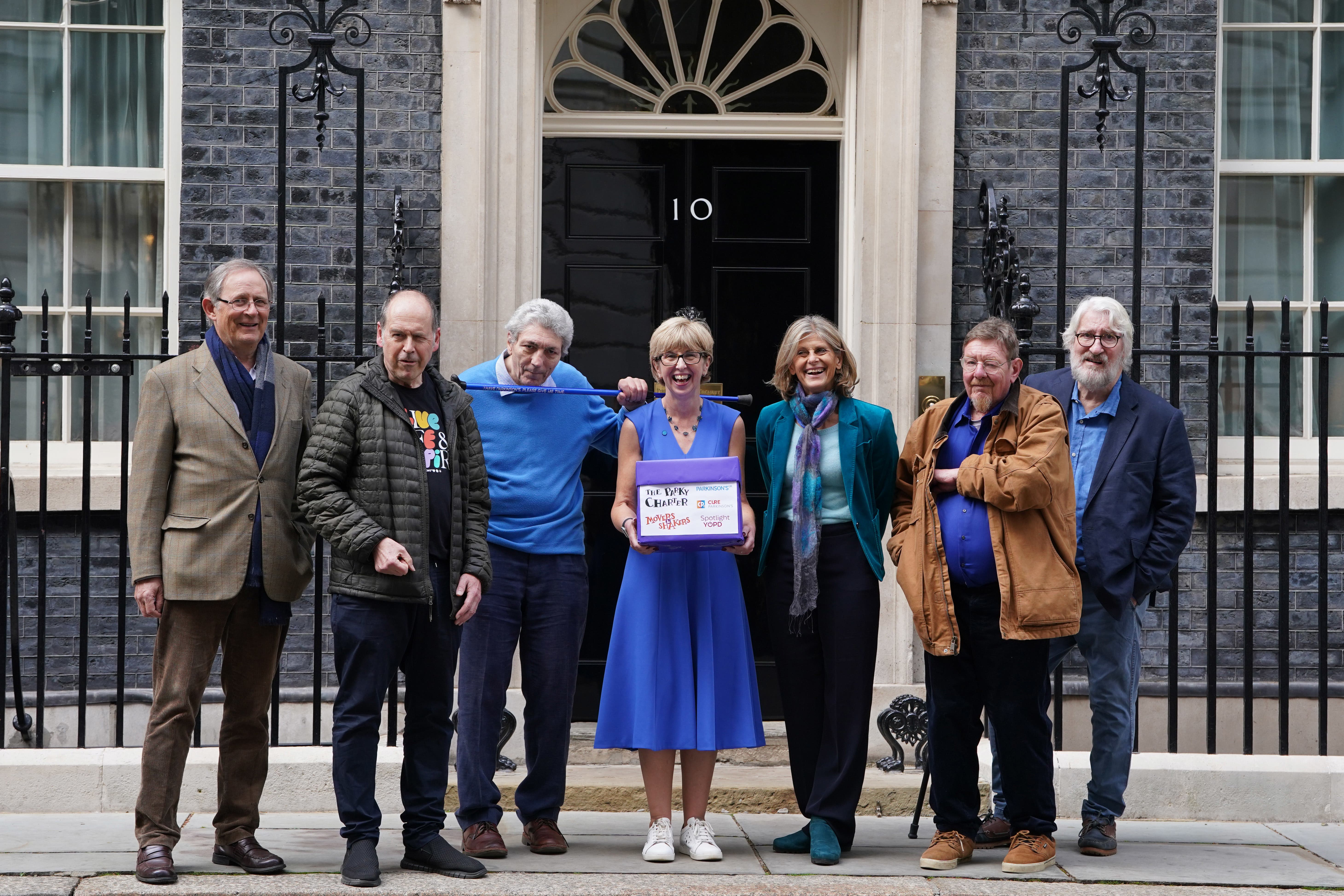 Hosts of The Movers and Shakers podcast (left-right) Sir Nicholas Mostyn, Rory Cellan-Jones, Paul Mayhew-Archer, Gillian Lacey-Solymar Mark Mardell and Jeremy Paxman with Parkinson’s UK chief executive Caroline Rassell (centre) mark World Parkinson’s Day (Lucy North/PA)