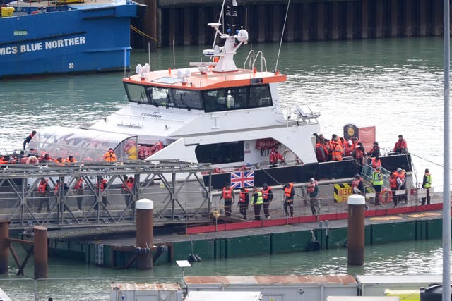 <p>A group of people thought to be migrants arriving at Dover, on the Kent coast </p>