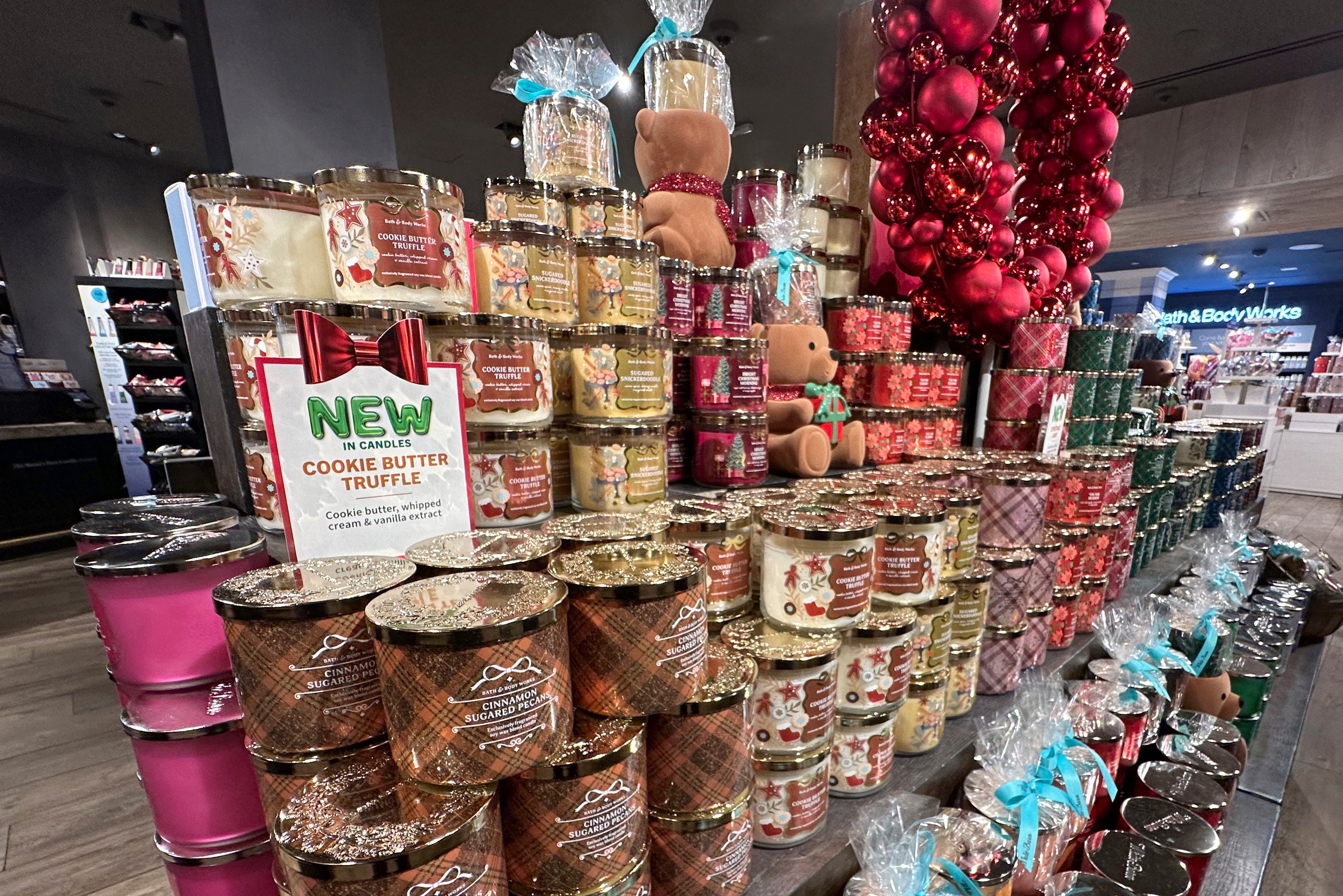 An arrangement of holiday themed scented candles is shown at a Bath and Body Works store on Wednesday, Oct. 9,