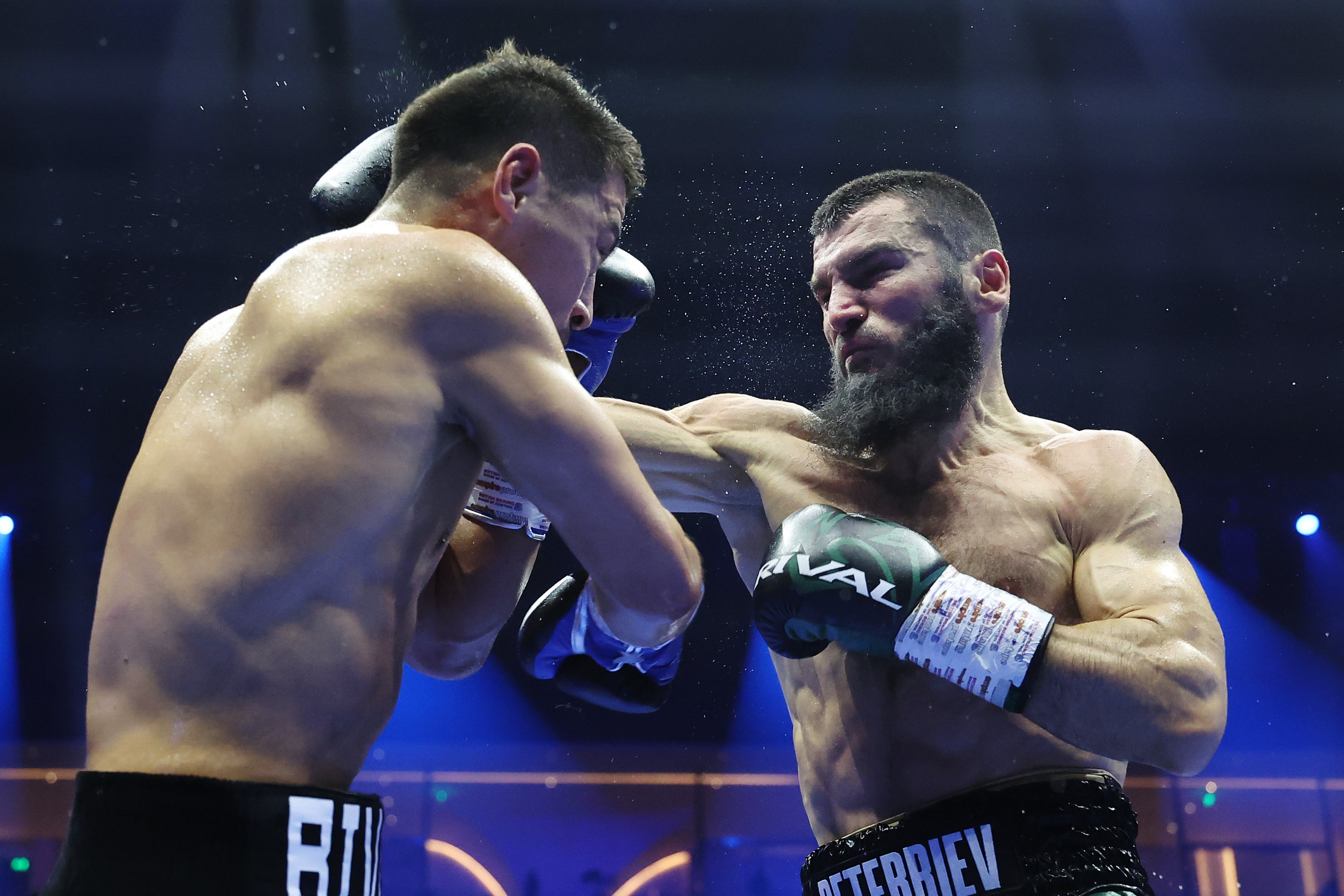 Dmitry Bivol (left) will face Artur Beterbiev in a rematch on 22 February