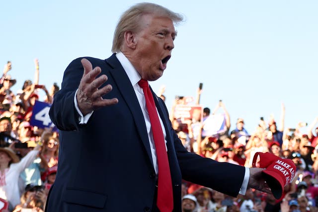 <p>Republican presidential nominee, former U.S. President Donald Trump gestures as he walks onstage for a campaign rally on October 12, 2024 in Coachella, California</p>