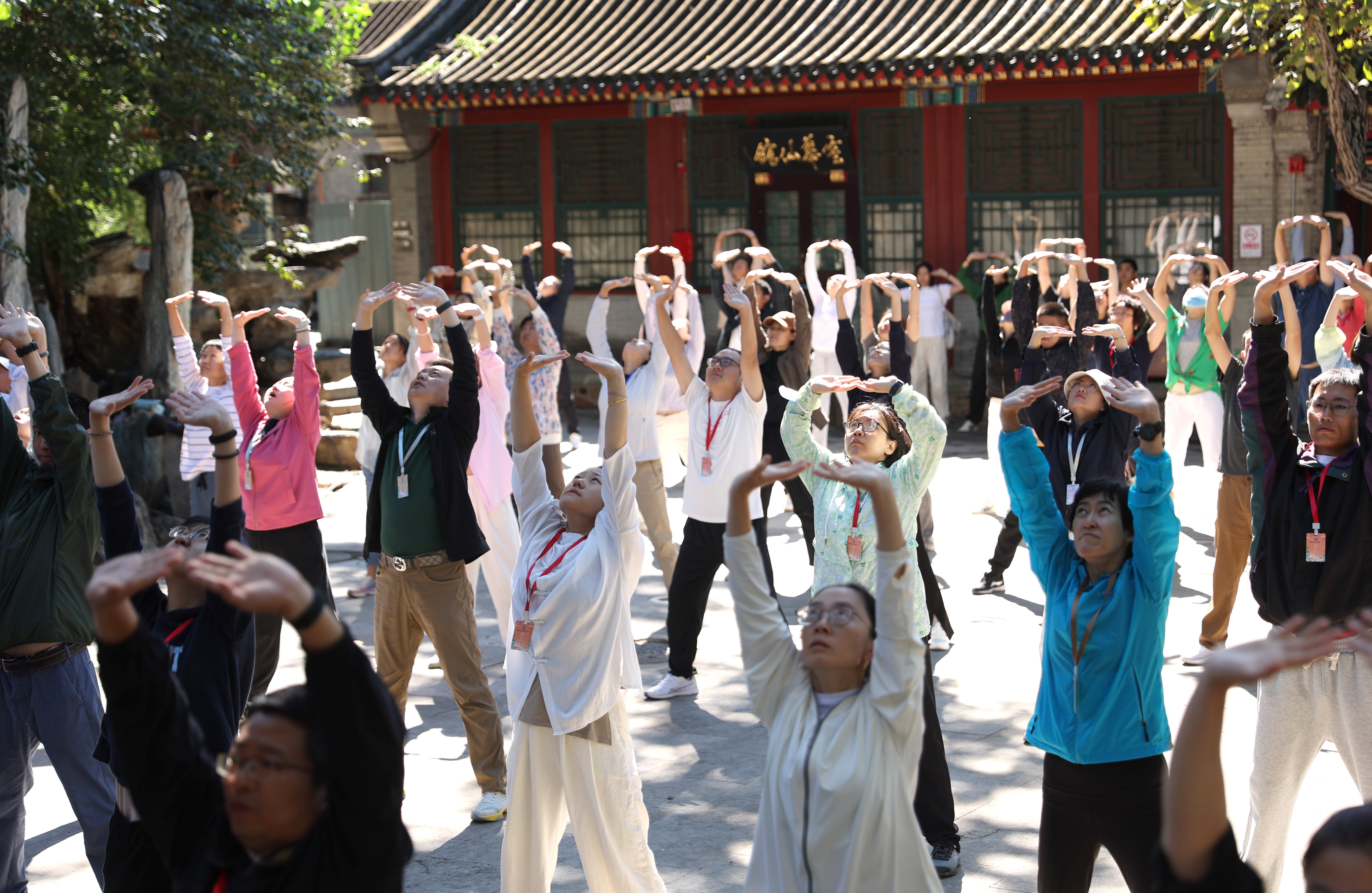 People attend the baduanjin exercise class at the temple