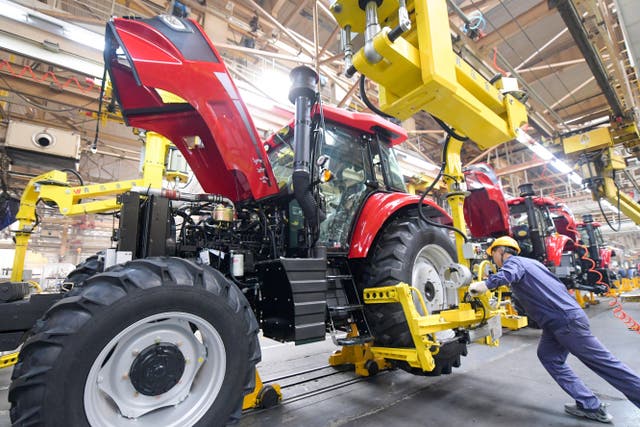 <p>An employee works on a heavy machinery production line in Luoyang, Henan province</p>