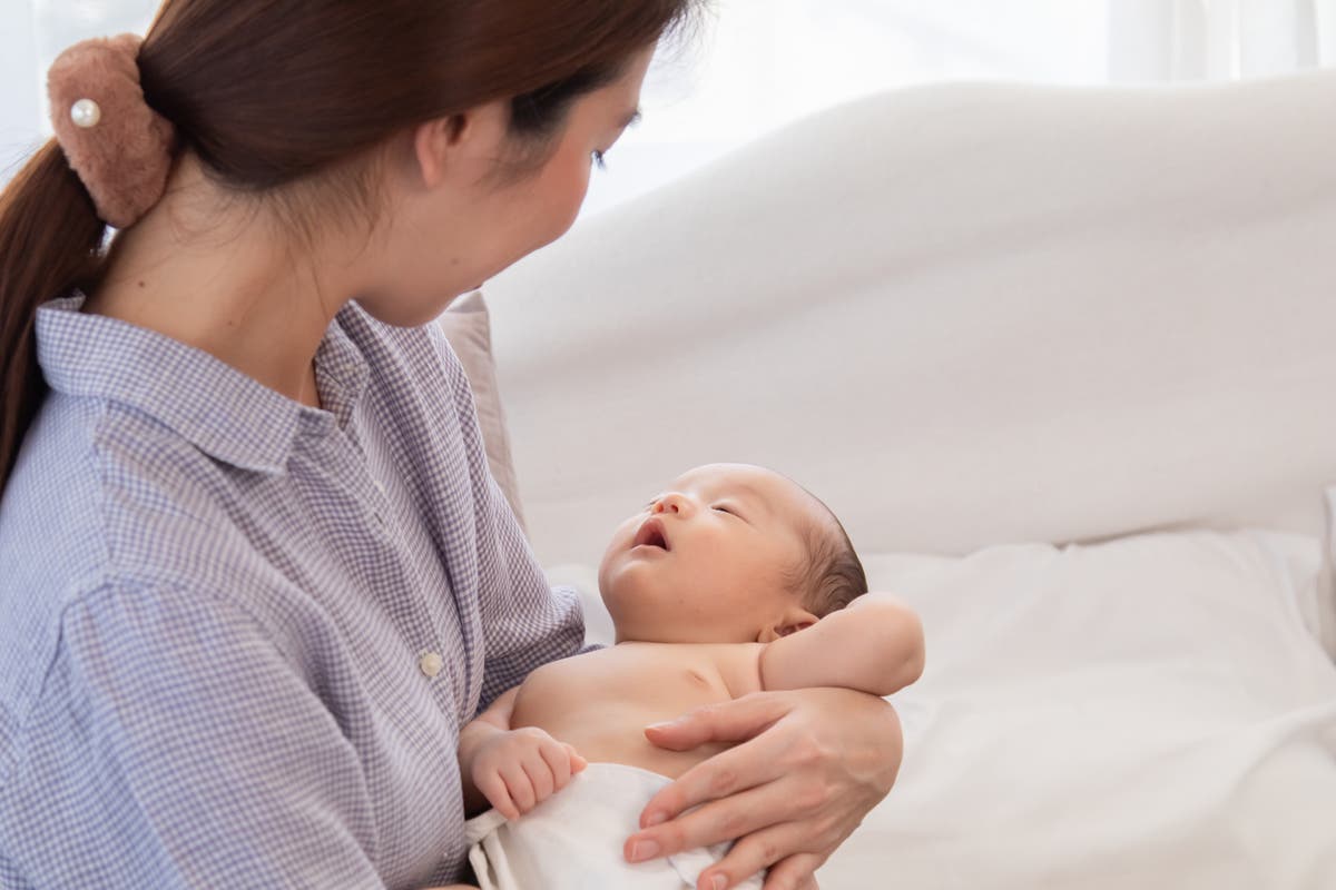 The country with lowest fertility rate gives medals to two women who had 13 children each