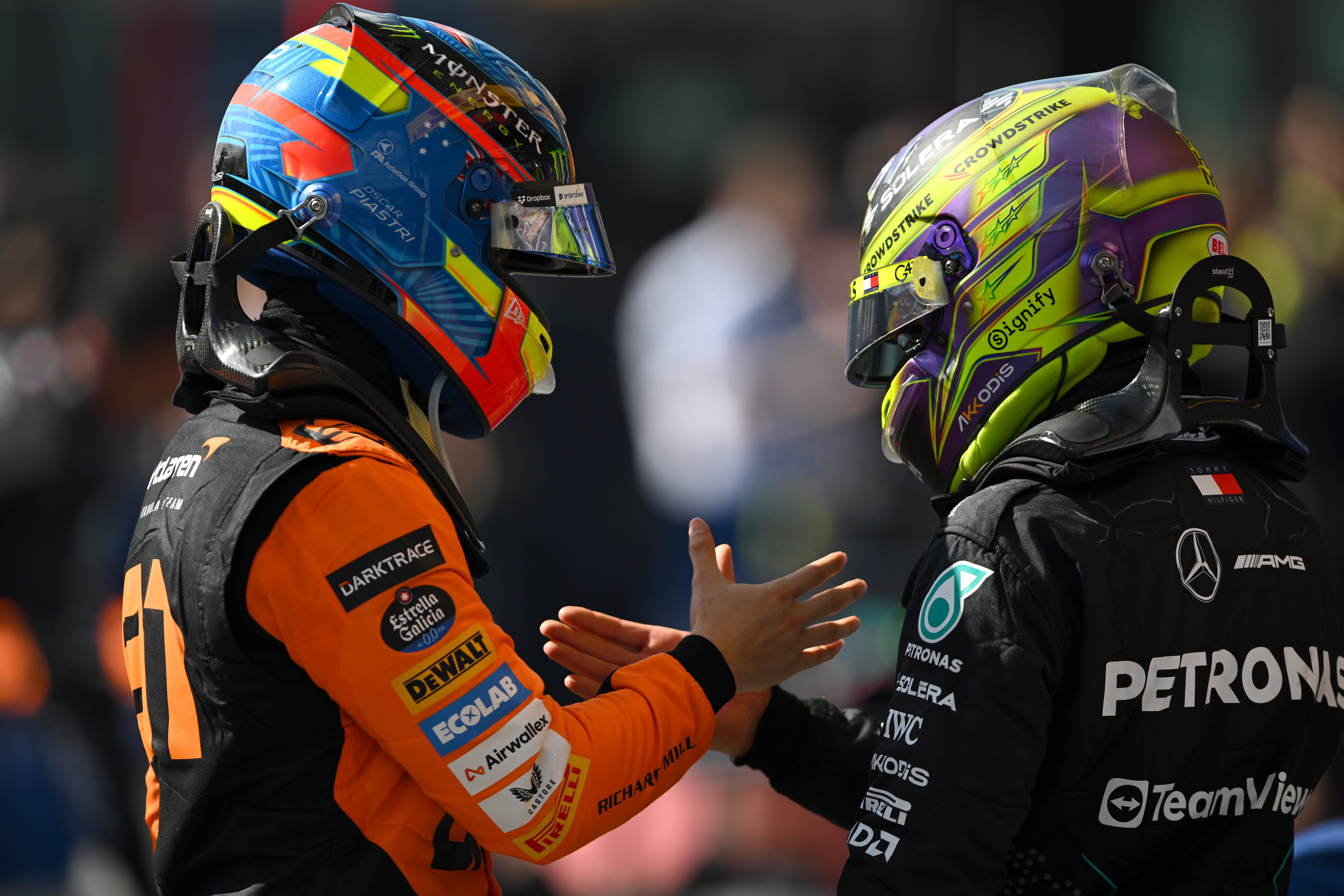 Oscar Piastri and Lewis Hamilton shake hands after July’s Belgian Grand Prix