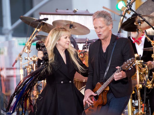 <p>Stevie Nicks and Lindsey Buckingham performing together with Fleetwood Mac in 2014</p>