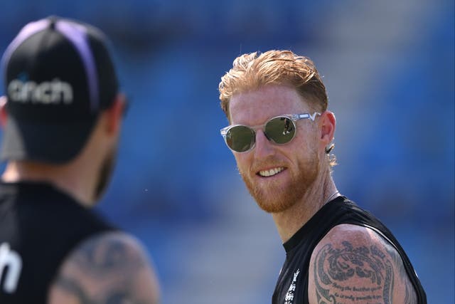 <p>England captain Ben Stokes smiles as he talks to coach Brendon McCullum during nets</p>