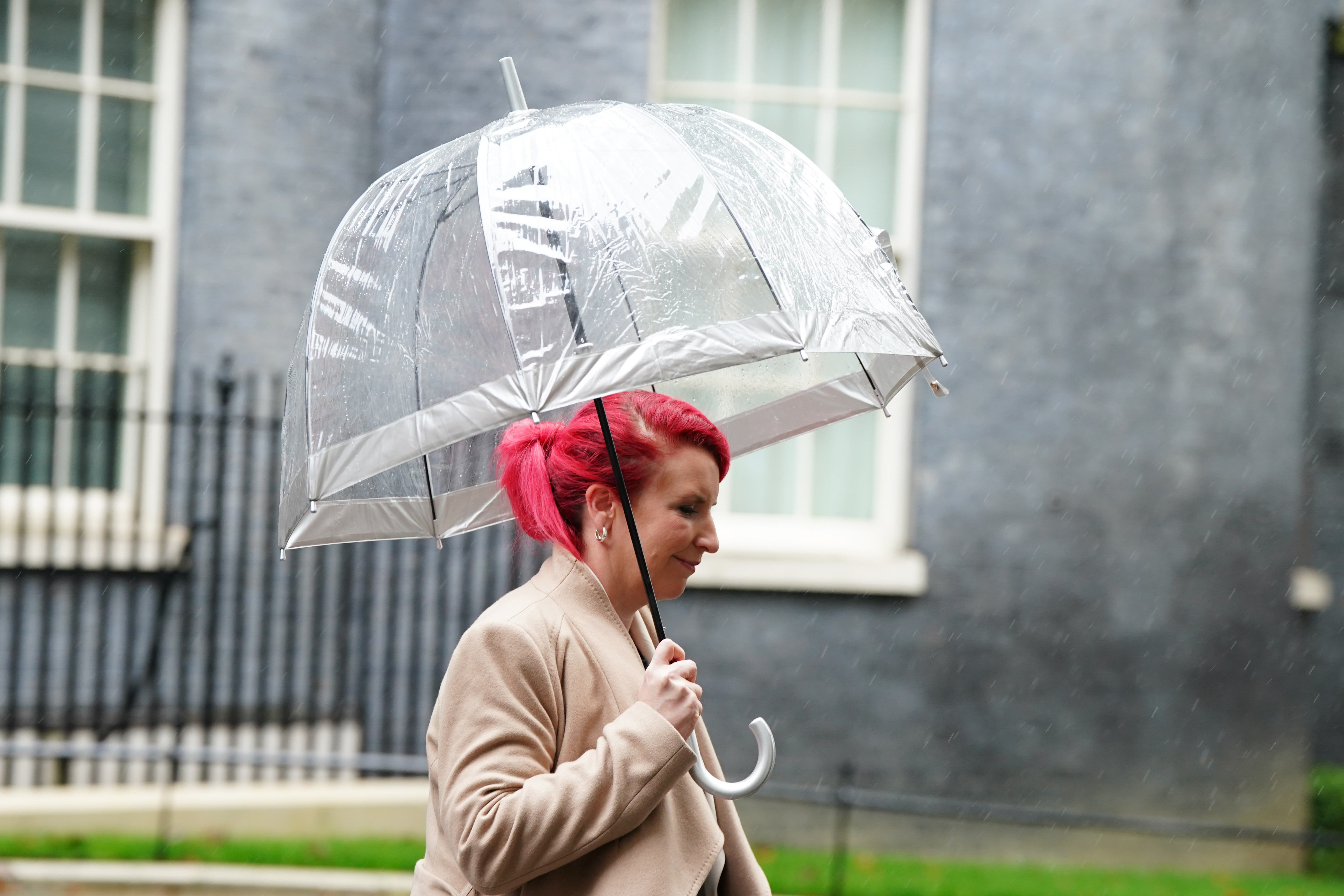 Taking cover: Transport secretary Louise Haigh leaving Downing Street