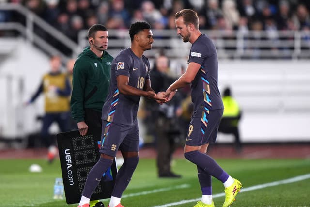 Ollie Watkins, centre, replaced Harry Kane, right, in Helsinki (PA)