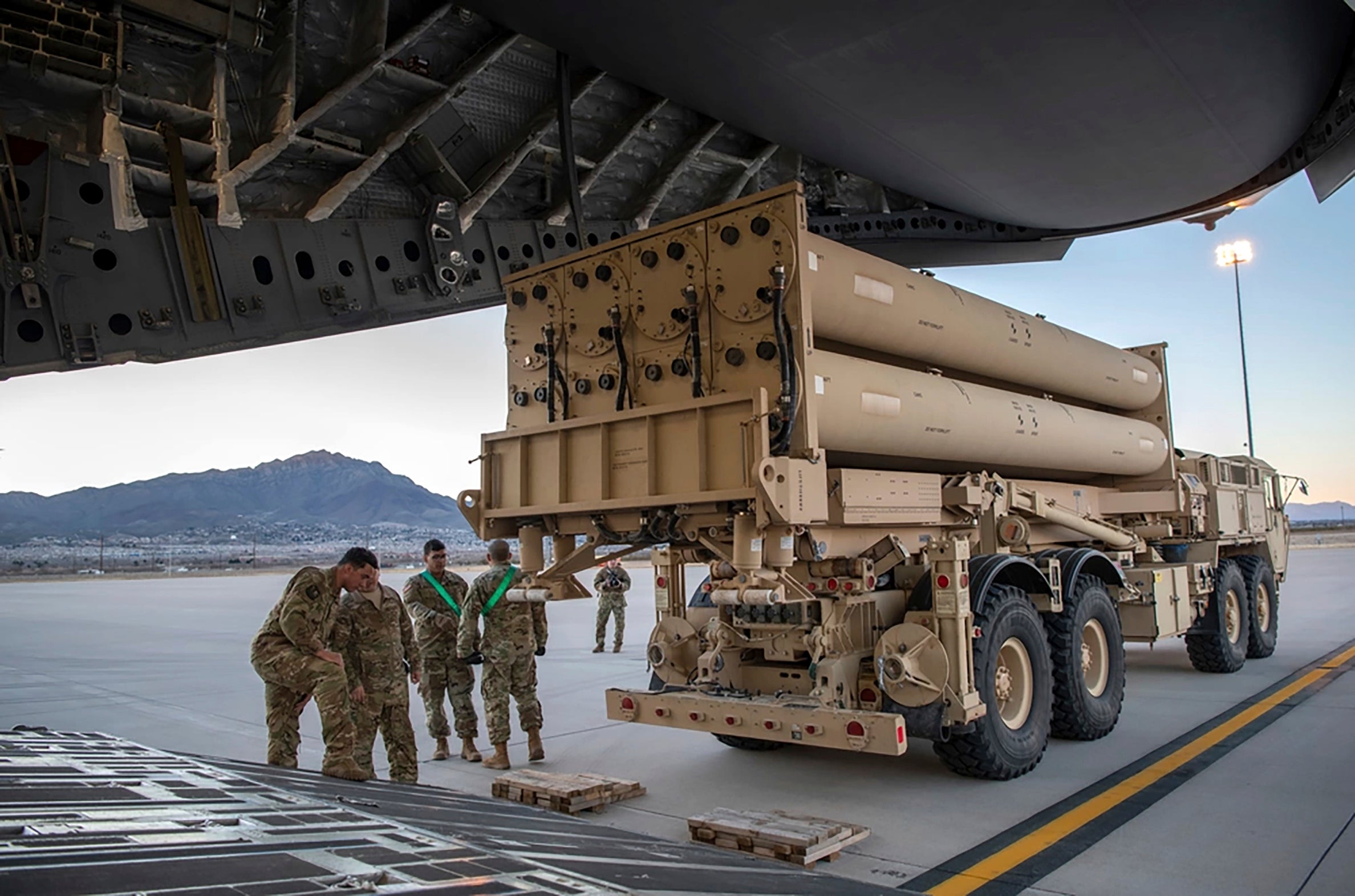 A Terminal High Altitude Area Defense (THAAD) launching station being loaded onto a 4th Airlift Squadron C-17 Globemaster III in Texas