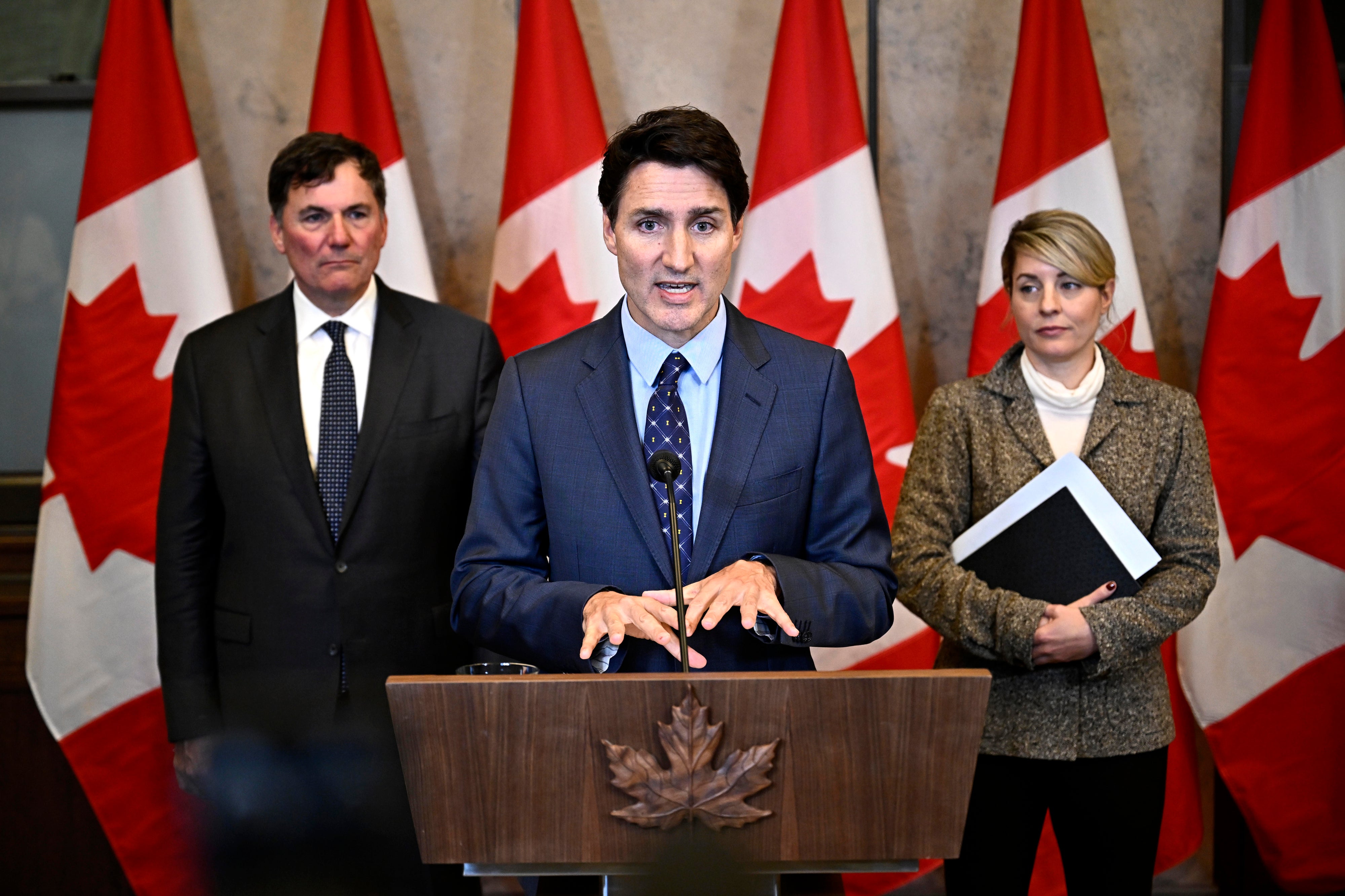 Canadian Prime Minister Justin Trudeau, centre, Minister of Public Safety, Democratic Institutions and Intergovernmental Affairs Dominic LeBlanc, left, and Minister of Foreign Affairs Melanie Joly participate in a news conference